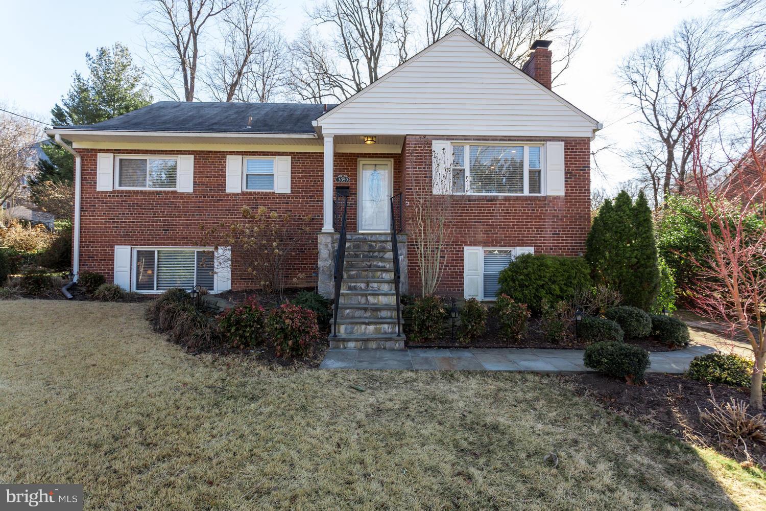 Rock Solid & Renovated! *Highlights = ALL brick home. Updated exterior steps & railing, fenced rear yard with deck & patio. Professionally landscaped - incl lawn (Zoysia). Entry level Master Suite w/FAB Master bath. Light-filled Living rm w/FP flows into  Dining room & Renov Kitchen. Lower level = (big) Rec room, sep laundry rm & sep storage. Guest Suite w/full bath & walk-in closet! A+ commuters