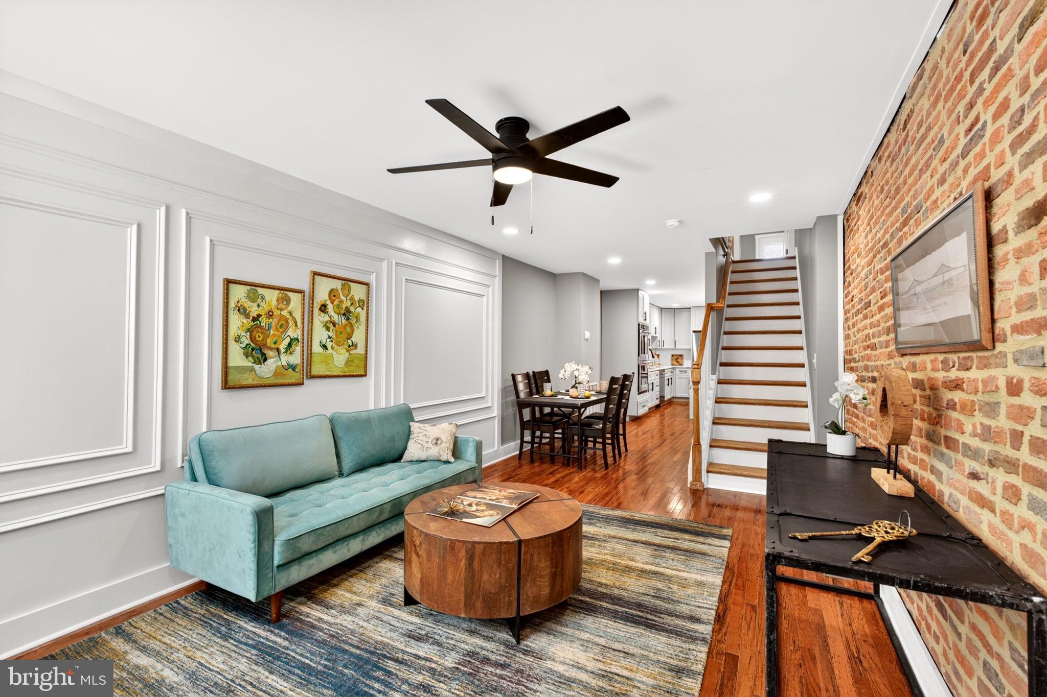 Welcome to 1342 Andre Street in sought-after Locust Point—a fully reimagined home offering modern luxury, thoughtful design, and exceptional CHAP tax savings and PARKING.

The main level features a spacious open-concept layout with a large living room, dedicated dining area, and a show-stopping kitchen. Designed for both style and function, the kitchen includes a waterfall island, double wall oven, cooktop, stainless steel appliances, quartz countertops, and a full quartz backsplash that elevates the entire space. A convenient rear laundry room leads directly to a private parking pad.

Upstairs, you’ll find two generously sized bedrooms. The primary suite offers a spa-like bath with a walk-in shower, double vanities, and striking green designer subway tile accented with a custom palm tree detail, paired with brushed gold fixtures. A second large bedroom and a beautifully finished hallway bath complete this level. From the rear bedroom, step out onto your private rooftop deck with sweeping skyline views of Baltimore, including Silo Point—perfect for relaxing, entertaining, and enjoying fireworks displays.

The fully finished walk-out basement adds even more flexible living space, featuring a full bathroom and two additional rooms ideal for a gym, home office, guest suite, or family room.

This home also qualifies for significant CHAP tax credit benefits ( (pending final approval). Based on an initial appraised CHAP value of $224,000 and an estimated ARV of $530,000, the projected tax credit is approximately $6,879 per year, translating to an estimated $573/month savings toward the buyer’s mortgage payment—making this not only a stunning home, but a financially smart investment.

All of this in a prime Baltimore location just minutes from the waterfront, dining, parks, and city attractions.
