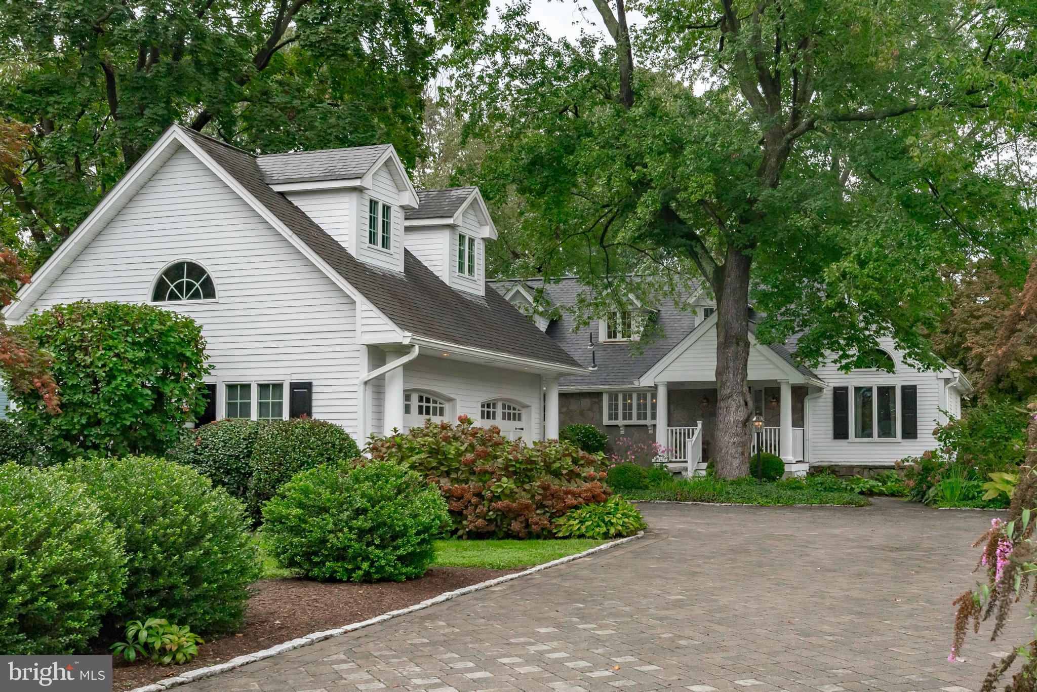 **Appraisers: This property had multiple offers above list price.  The buyer paid Cash but chose to get a loan in the background and the property did appraise at contract price. ** Nantucket meets Martha's Vineyard in this charming Cape Cod with protected  and deep water on beautiful Burley Creek. Boathouse (8 ft MLW), boat lift, room for 3-4 slips, seating area and kayak / canoe launch, all updated in 2017. Boathouse has a metal roof and is approximately 17'x36' and lift is external to the boathouse (12,500 lbs).  Main level primary bedroom and updated primary bath 2018.  Updated kitchen with granite counters and stainless appliances and wine fridge, 2018. Vaulted post and beam ceiling in the dining room with an adorable and secluded reading nook for two. Traditional floor plan with hard wood flooring and an impressive stone fireplace with wood mantel anchoring the family room overlooking the screened porch and waterfront.  Recently built two car garage with floored storage above and newer paver driveway from Stewart Landscaping 2016. Newer roof, 2019. Updated finished basement, 2021 with a stone fireplace and ample storage and walk-out stairs. Upper level has three bedrooms with vaulted ceilings and traditional dormers. Specimen plantings in immaculately maintained gardens throughout the yard.  Updated septic system in 2018 and newer water treatment system 2019.  Guardian Generator. Beechwood on the Burley Community Association is a Voluntary HOA ($50/year) providing access to a park, community dock with slips, a playground, picnic area and kayak racks across the street on Little Burley Creek, as well as progressive dinners and quarterly parties.