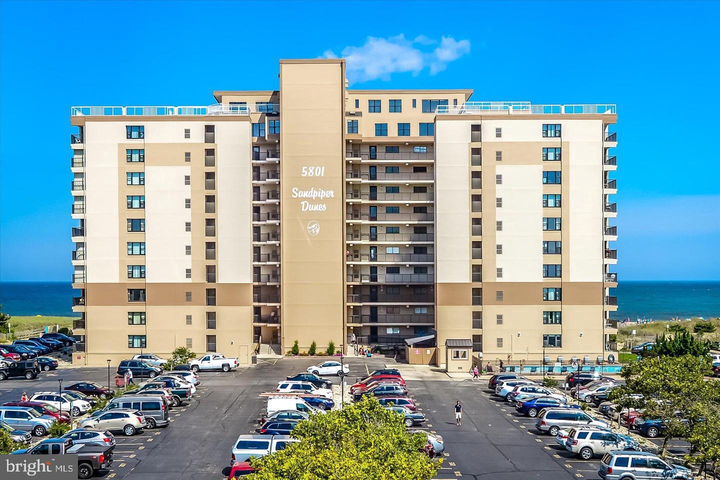 Direct oceanfront condo in the popular Sandpiper Dunes building.  This condo offers a larger floor plan with one bedroom, one full-bathroom, one half-bathroom and an open living area.  The living area features a nice sized living room with a newer sliding glass door and the kitchen with updated appliances and a convenient breakfast counter.  There is a good-sized, private balcony off of the living area that is a great place to relax, unwind and enjoy the beautiful direct oceanfront views.  The large bedroom features tile flooring, ceiling fan and an ensuite half-bathroom.  The full-bathroom is centrally located and easily accessible from throughout the condo.  This condo has been well-maintained and is in very good condition.  Building amenities include an outdoor pool, assigned parking, multiple elevators, outside shower and easy beach access.  Restaurants, shopping, amusements and more are all within a short walk.  Schedule your showing today.