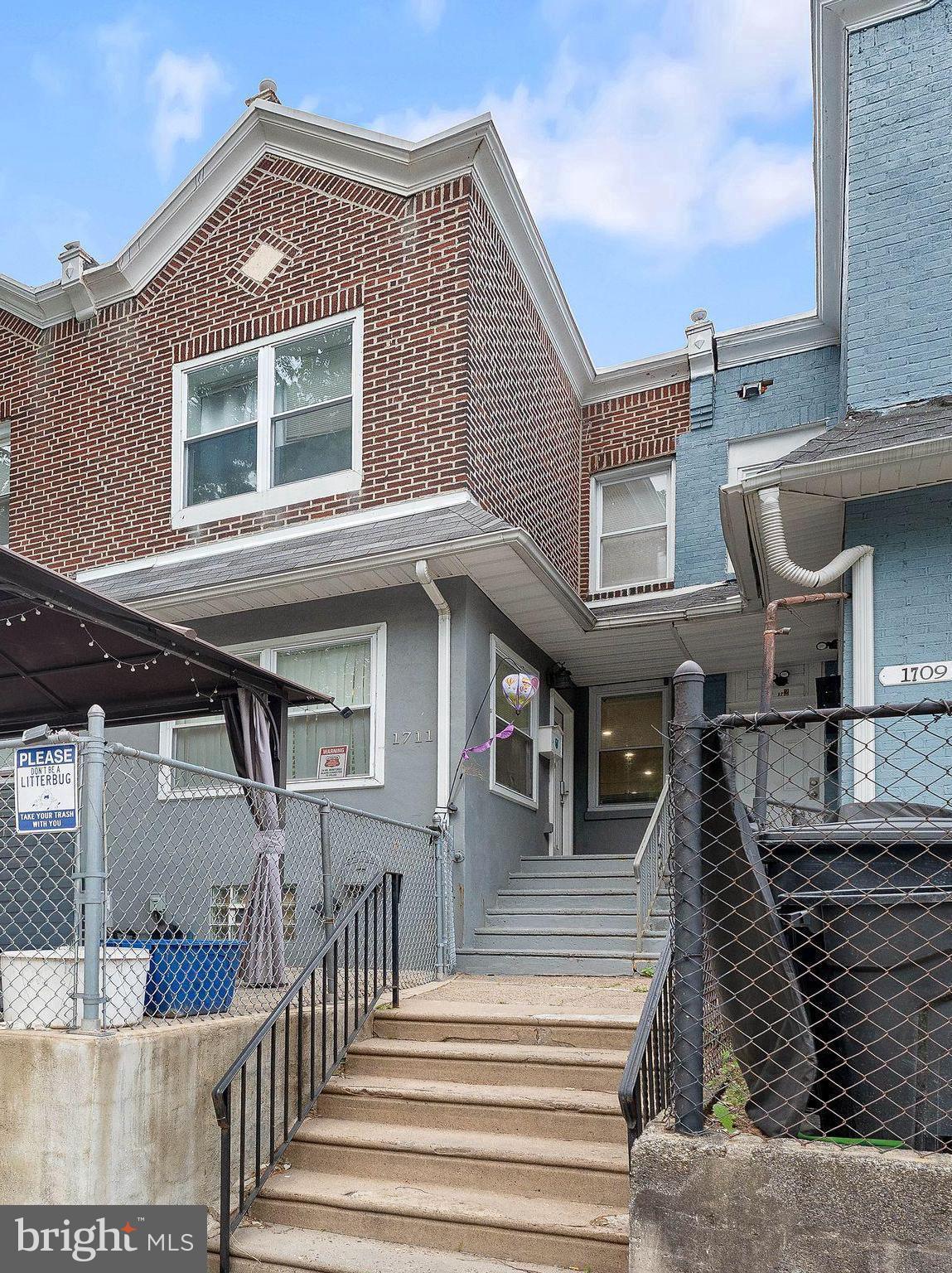 A sleek and modern Row house with nearly 1400 SQFT and a Finished Basement that adds additional 600 square feet! The interior is equipped with 3 Bedrooms that are ample with space with walk-in closets as an added luxury. The Living room, Dining room, and Kitchen are beautifully interconnected offering a large open concept interior! Downstairs nearly mirrors upstairs. Basement is finished and equipped with a Full Bathroom  possibly serving as an in-law suite if needed. ALL APPLIANCES ARE 5 YEARS OLD!  HOT WATER HEATER (2025), HVAC (2020), ROOF (2020). Comes with a 2 SPOT DRIVEWAY in the back of the house that as an added benefit. 3 minutes from Route 1, 15 minutes from center city! 2 MINUTE DRIVE FROM LASALLE COLLEGE!  The whole house was renovated 5 years ago, so its move in ready!  AS IS.  Zoning is RM1 (two family zoning), so possibility of converting to a duplex officially is there! Would need separate electric, utilities, and a variance.