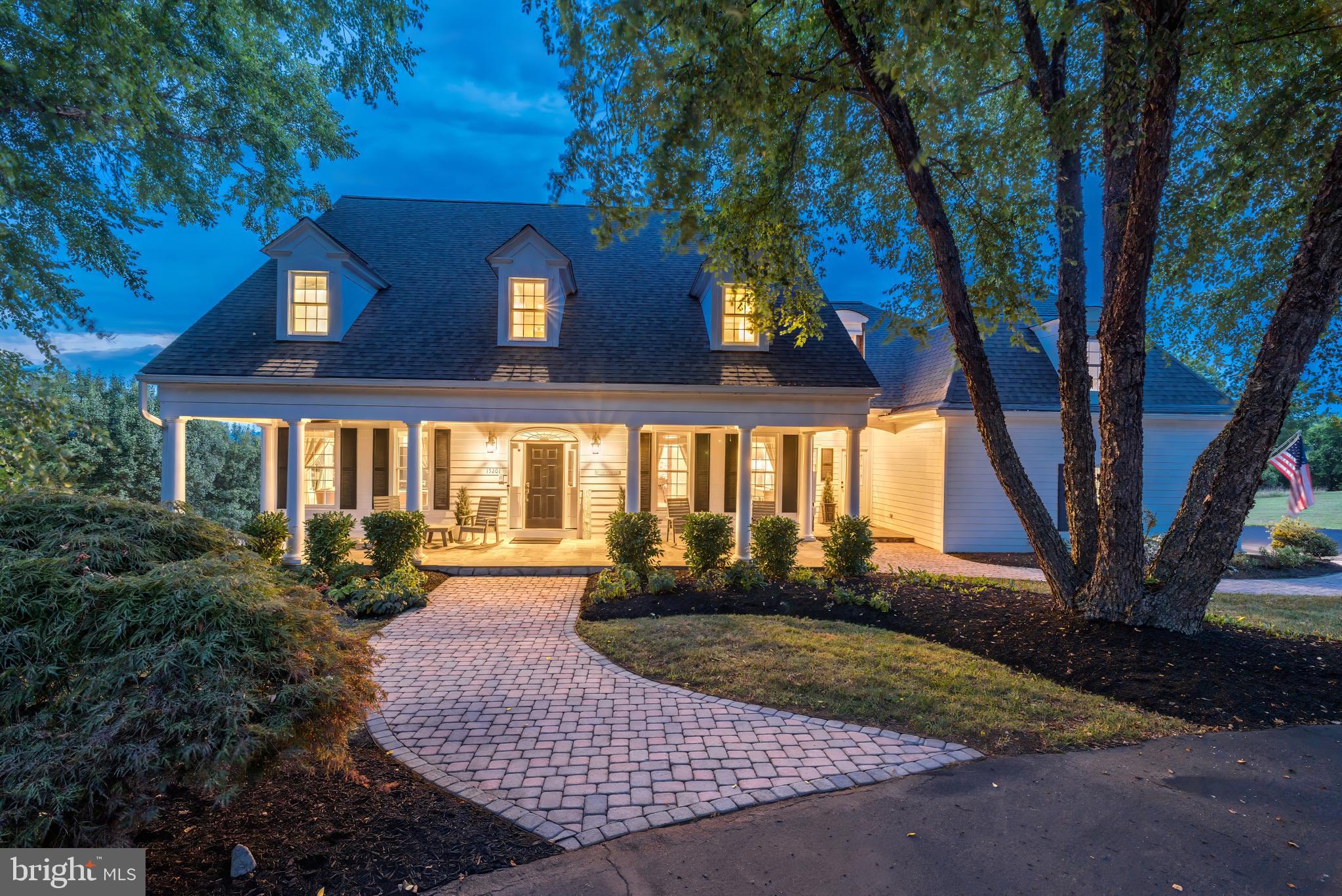 Elegant Country Luxury! Experience the idyllic charm of northern VA at its best, here in the exclusive community of Waterford Heights. Commanding nearly 4 acres of lush land, set against the backdrop of mountain views, this picturesque Custom estate offers a tranquil retreat from the hustle and bustle of daily life. Arrive to a classic, covered slate porch, 2-car side-load garage and generous motorcourt, providing ample space for guests and gatherings. Enter inside to a soaring two-story foyer with vaulted ceilings, and rich hardwood floors that extend throughout the main level. The generous interior spans over 5,600 sq ft, including a fully finished, walk-out basement, creating opportunities for both formal entertaining and everyday living. The formal dining room is ideal for gatherings or weeknight homework, while the private home office with built-ins provides a quiet sanctuary for work. This layout also includes a desirable main-level bedroom suite with spa bath, and a spacious laundry room with storage. The gourmet kitchen is a chef’s dream, featuring a large granite island, quality solid-wood cabinetry and high-end appliances, including a Wolf range, Sub Zero refrigerator, and Sub Zero wine cooler. The open concept seamlessly transitions to a family room off the kitchen, where vaulted ceilings and a stone fireplace offer cozy ambience, and large windows flood the space with natural light. Upstairs, discover a flexible loft and three additional bedrooms, including an impressive primary suite with a huge walk-in closet and an en suite spa-inspired bathroom. The lower level offers even more versatile space with a living area and second fireplace, exercise room, and a full bath. Move outside to the rear deck and take in the breathtaking mountain views. The large patio and expansive backyard provide the perfect setting for outdoor entertaining, relaxation and future pool, outdoor pavilion and/or horse barn.  *New Roof recently installed.   Tucked away in Loudoun County's wine country, this home is worlds apart yet just a short drive from the charming village of Waterford, shops, restaurants, and historic downtown Leesburg. With smart modern conveniences like geo-thermal HVAC and high-speed internet, this property seamlessly blends country charm with contemporary comfort. In this historic setting, create your legacy and unlock a sought-after lifestyle. Welcome home!