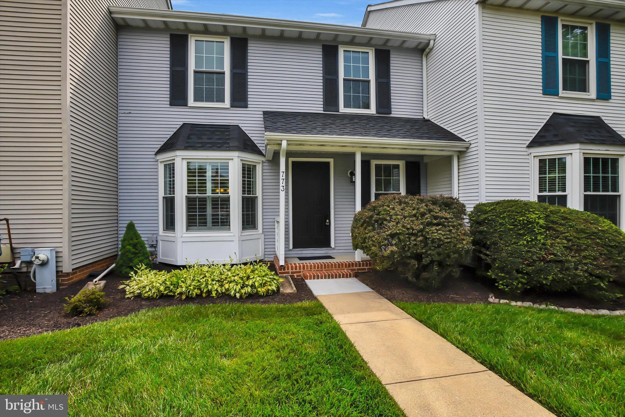 Don't miss the opportunity to tour this stunning, move-in-ready home featuring spacious living areas, modern updates, and a desirable community setting. This home combines comfort, style, and functionality in a wonderful community setting! Beautifully maintained and move-in ready, it features an updated kitchen with quartz countertops, upgraded cabinetry, new carpet/hardwood floors, and and fresh paint throughout. Upstairs, you'll find a spacious primary suite featuring a walk-in closet and a private en-suite bath with a soaking tub and separate shower. Two additional generously sized bedrooms complete the upper level, offering comfortable space for family, guests, or a home office. Enjoy peaceful wooded views from the deck and a finished walk-out lower level opening to a private patio — perfect for relaxing or entertaining. Major updates include a new roof (2020), custom plantation shutters, energy-efficient windows and doors (2019), water heater (2017), and washer/dryer (2022).  Driveway and abundant parking. The community offers over 20 acres of open space with HOA-maintained lawns for easy, low-maintenance living. Schedule your private tour today!