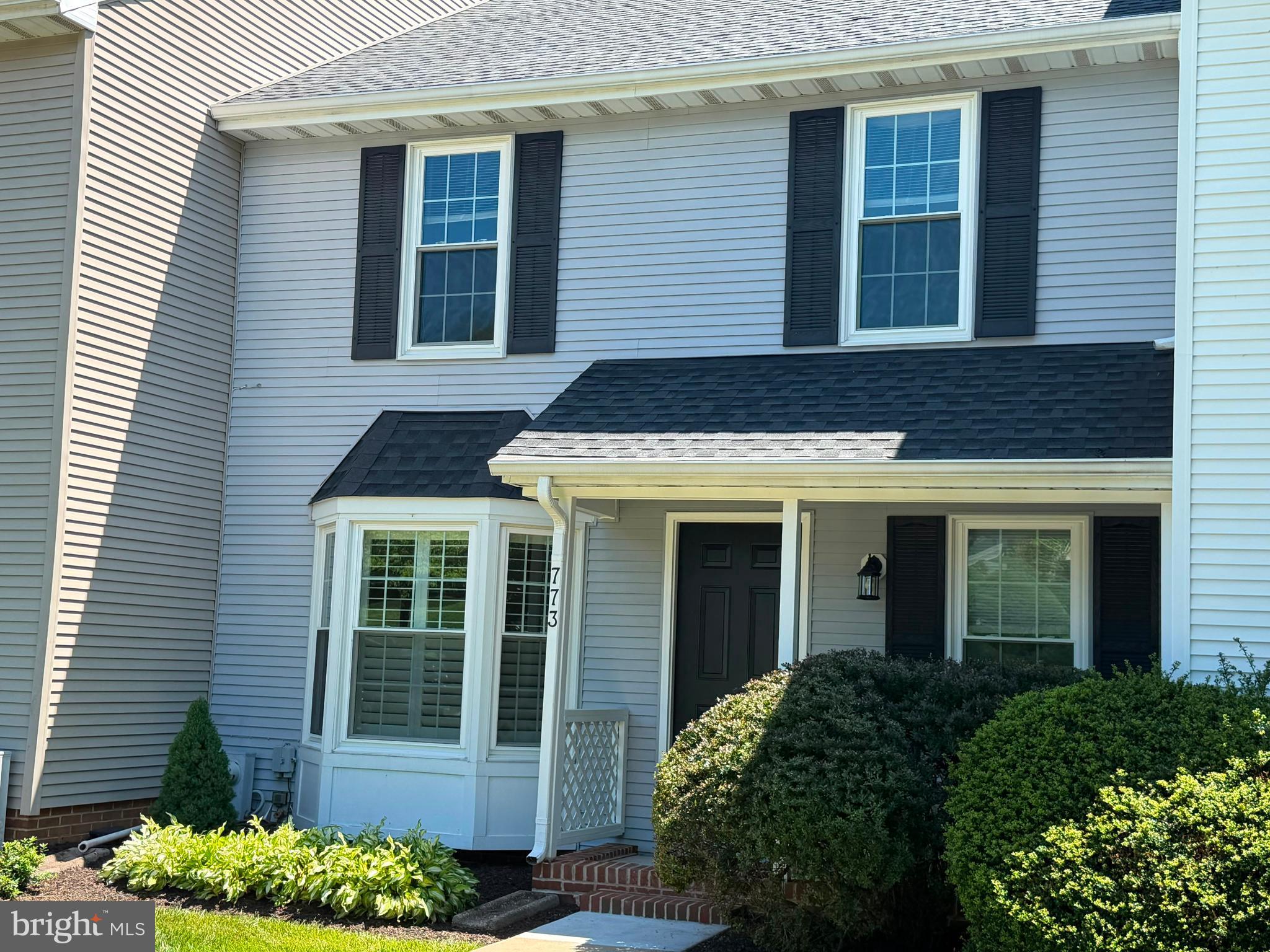 This home combines comfort, style, and functionality in a wonderful community setting! Beautifully maintained and move-in ready, it features abundant parking, an updated kitchen with quartz countertops, upgraded cabinetry, new carpet/hardwood floors, and and fresh paint throughout. Major updates include a new roof (2020), custom plantation shutters, energy-efficient windows and doors (2019), water heater (2017), and washer/dryer (2022). Enjoy peaceful wooded views from the deck and a finished walk-out lower level opening to a private patio — perfect for relaxing or entertaining. The community offers over 20 acres of open space with HOA-maintained lawns for easy, low-maintenance living. Immediate availability.