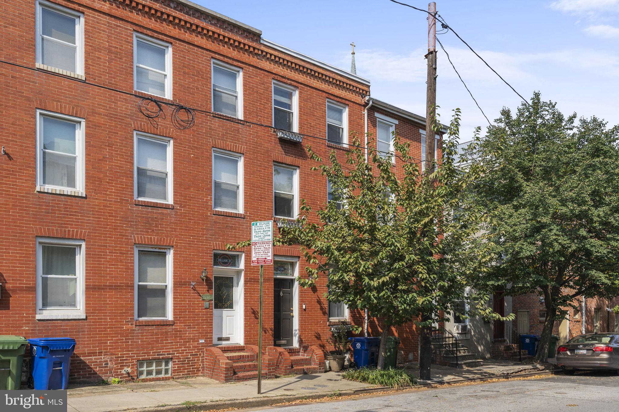 Property available 5/31/2025 - Welcome to 1206 William Street. This home is located on one of the cutest streets in Federal Hill. This beautifully renovated townhouse has tons of character and charm. It has original wood floors throughout, exposed brick, three gas fireplaces, and skylights for tons of natural light. The front door opens to the living room complete with high ceilings and a beautiful gas fireplace. On the first floor, there is a separate dining room with a second gas fireplace, a half bathroom with laundry, and most importantly, an updated kitchen with stainless steel appliances and a gas stove. There is a door leading out to the private fenced patio, perfect for entertaining guests. The second floor features two bedrooms and a full bathroom to be shared between them. The first large bedroom has a gas fireplace while the smaller second flex room opens to the deck offering even more outdoor space. The private third-floor bedroom is completed with an ensuite bathroom. This home is in close proximity to all that Federal Hill and the Inner Harbor has to offer. Applicants please apply at https://apply.link/GSDxQ4E Rent Spree Link