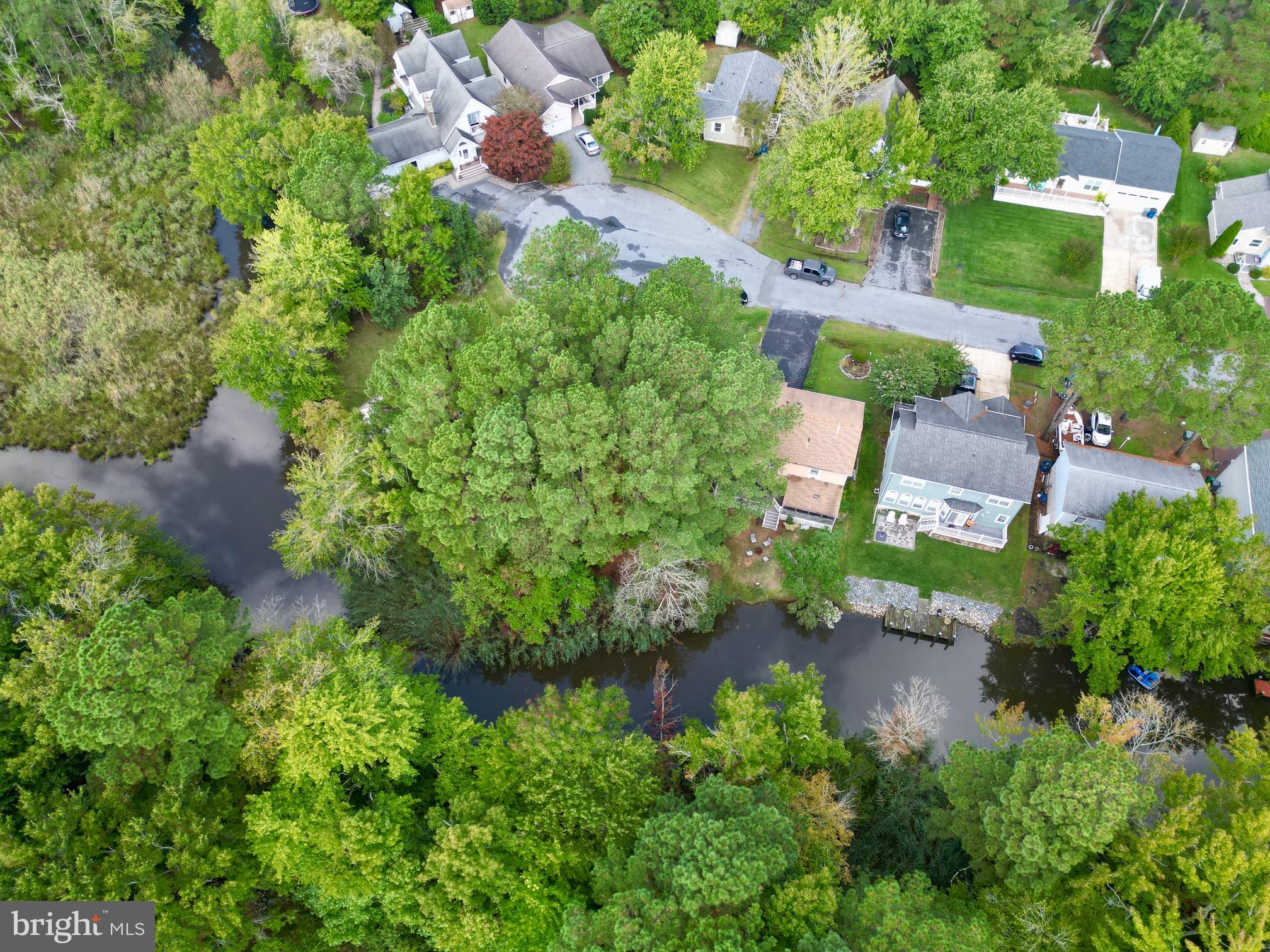 Welcome to 21 Alden Ct, a serene 0.15-acre lot tucked at the end of a peaceful cul-de-sac in the sought-after Ocean Pines community. This prime lot offers the rare benefit of waterfront access, providing the perfect backdrop to design and build your custom home. Situated within the vibrant Ocean Pines, this property grants you access to a wealth of top-notch amenities, including the Ocean Pines Golf Club, outdoor pools, tennis and pickleball courts, basketball courts, and soccer fields. For boating and water enthusiasts, take advantage of the fishing marina with boat slips, and enjoy exclusive access to the Ocean Pines Beach Club on 49th St. in Ocean City. The community also boasts kids' play areas, walking and jogging trails, and numerous parks that cater to families and outdoor lovers alike. Savor a meal at the Yacht Club, overlooking the marina, or partake in the many social events such as ice cream socials, bingo, and community yard sales. Conveniently located just minutes from the beach, golf courses, dining, and shopping, this property offers the perfect blend of coastal living and everyday convenience. Across the street, a walkway leads you directly to a bustling farmers market, craft shows, live music under the pavilion, and a large playground. Don’t miss this fantastic opportunity to build your waterfront retreat in the heart of Ocean Pines!