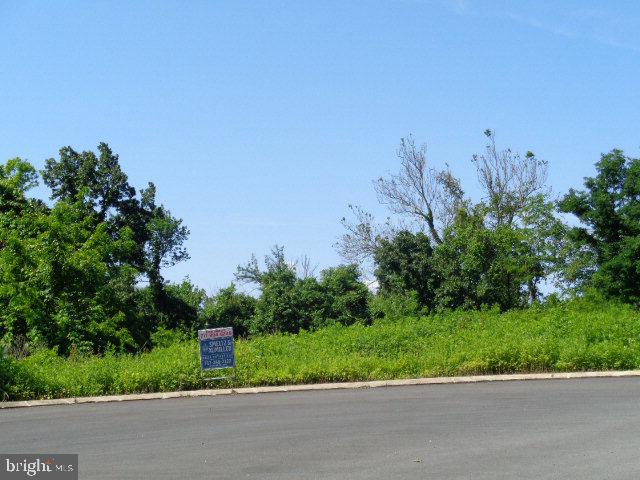 3.3 acres mostly wooded lot in Sand Rock Hills. This lot offers southern exposure to rear, all public utilities are underground. Water & Sewer taps are already paid for saving you $1,000's.  Great lot for daylight basement & panoramic views.  Call your builder and take a look today!