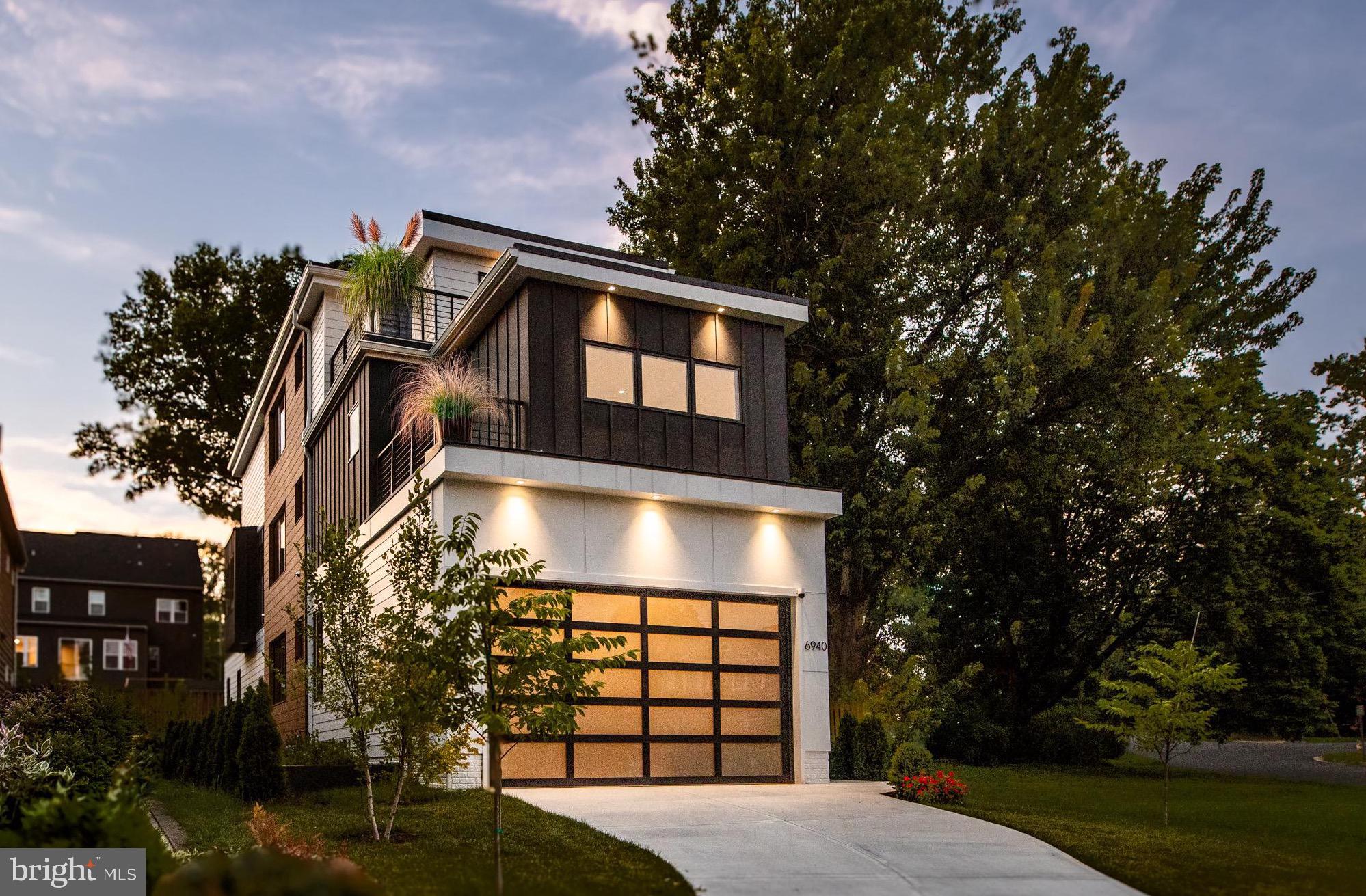 Falls Church City location with McLean schools, new construction, and contemporary
luxury — just minutes from Washington, DC. Open this Saturday and Sunday from 1–3
PM.
Homes of this scale, quality, and modern construction rarely come available in Falls Church
City. Designed for buyers seeking estate-level living without sacrificing proximity to
Washington, DC, this newly built luxury residence delivers exceptional space, refined finishes,
and effortless everyday living in one of Northern Virginia’s most desirable locations.
Thoughtfully designed with expansive living areas, high ceilings, and abundant natural light, the
home offers a seamless flow ideal for both daily living and entertaining. The chef’s kitchen
anchors the main level, featuring a 48” Wolf gas range, Wolf microwave, pot filler, quartz
waterfall island with Ruvati workstation sink, and generous prep space — all opening to the
home’s primary gathering areas.
The kitchen flows into a dramatic great room with a sleek gas fireplace and folding glass doors
that connect seamlessly to the deck and backyard, creating an exceptional indoor-outdoor living
experience. Wide-plank white oak flooring and designer Sonneman lighting establish a striking
first impression throughout the main level.
The upper-level owner’s suite provides a private retreat with a spa-inspired bath and generous
closet space. Additional bedrooms are well-proportioned and thoughtfully designed, many
featuring balconies — ideal for guests, family, or home office use.
The top-level suite and lounge open to a rooftop deck, perfect for entertaining, relaxing, or
enjoying sunset views. The finished lower level includes a spacious recreation room with wet
bar, a guest suite, and a flexible bonus room suitable for an office, gym, or sixth bedroom.
With newly built construction, buyers enjoy modern systems, energy efficiency, and today’s
premium design standards — a rare opportunity so close to Falls Church City, the WFC Metro,
and Washington, DC. The home is professionally staged, vacant, and available for immediate
private showings.