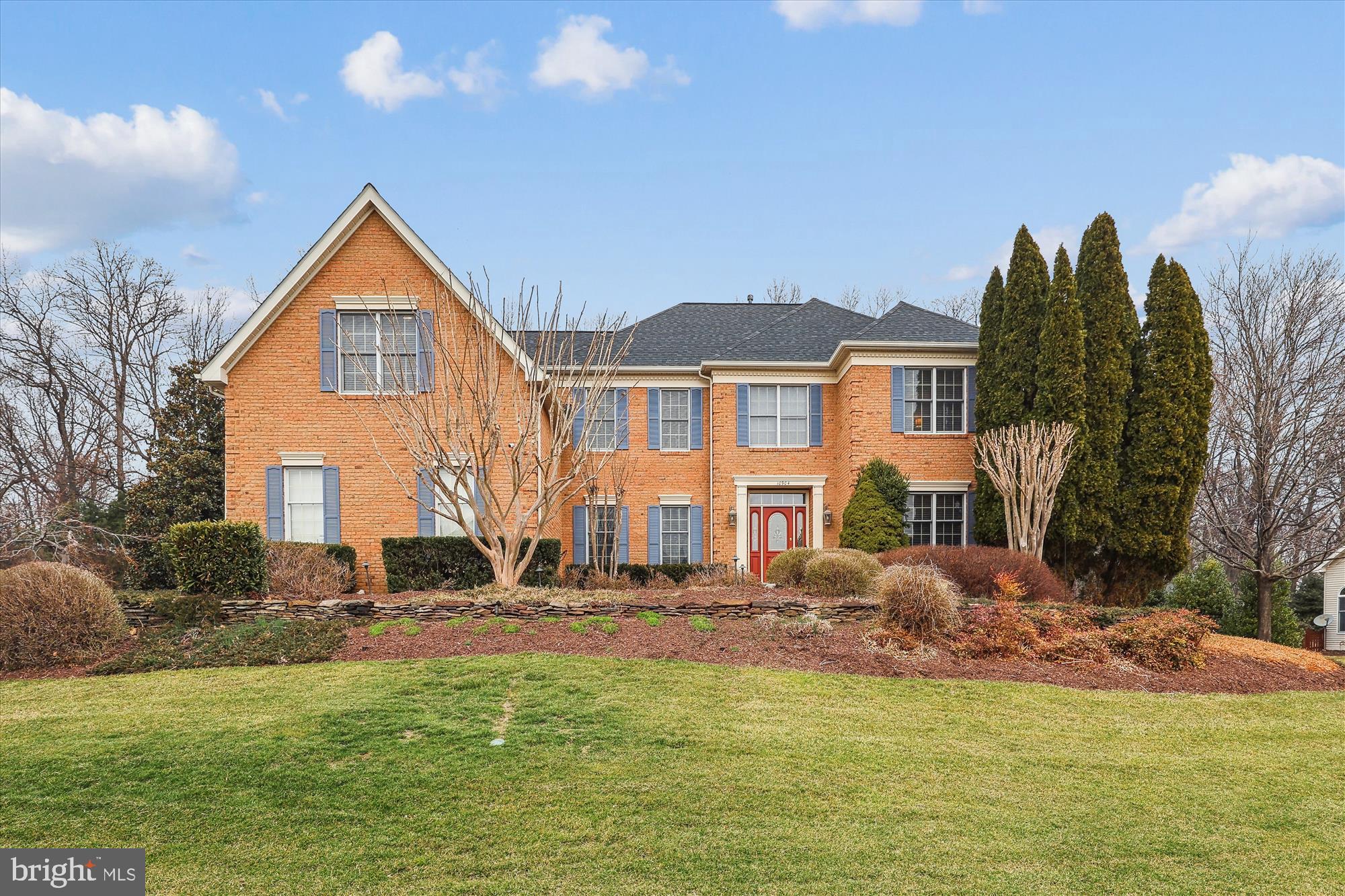 Welcome to this immaculate home, lovingly updated and maintained by the original owners in the fantastic neighborhood of Great Falls Crossing. 10904 Hunter Gate Way has been beautifully upgraded inside and out with great attention to detail. This 4 bedroom, 4.5 bath home offers over 5000 SF and is nestled on a very magical, near-acre, landscaped lot. This double lot commanded a $50,000 premium when purchased in 1999. A custom slate walk way, a pretty as a picture pergola, and a 3-car side load garage invite you in to a spectacular open floor plan with a grand two story foyer, dual staircases, and a catwalk overlooking the family room. The formal living room and dining room feature extensive molding and designer touches with an accent fireplace and elegant wallpaper. The gourmet eat-in kitchen showcases white cabinetry with stainless steel Kitchen Aid appliances, a leathered granite island with seating, gorgeous backsplash, pendant lighting and cabinet lighting, plus a large pantry with pull-outs. A spacious breakfast room leads into the family room with soaring ceilings, built-in cabinetry, a gas fireplace and sky lights. The beautiful sunroom with a wall of windows has vaulted ceilings, sky lights and a sliding glass door to an AWESOME screened-in porch, large enough for two sitting areas, with ceiling fans, an outdoor TV, and impressive wood ceilings. This is outdoor living at its finest with a slate patio running the expanse of the backyard, a built-in gas grill, a firepit, a retractable awning and mature landscaping. The mud room is beautifully finished with charming wainscotting and LVP floors offering additional cabinetry and access to the screened in porch. A spacious office with a wall of custom built-ins and an updated powder room complete the main level.
The enormous primary suite was reconfigured to offer not two walk-in closets but THREE. There is closet space galore with two additional sitting areas that are perfect for a dressing room, an office, workout room, or media room. The luxury primary bath has been renovated with a claw tub, dual vanities and oversized glass doored shower. The other 3 bedrooms are all spacious with ample closet space, one includes a renovated ensuite bath while the other two share the renovated hall bath. All beautifully done. 
The lower level is a real treat with a large Clyde’s-like bar that can easily sit 6 with custom cabinetry and the conveniences of a refrigerator, dishwasher, ice maker and television. The pool table conveys and there is still room for a large recreation area. Through a glass door, you will find a proper poker room/game room with custom shelving and a secret white board for more family gaming fun. This room is equipped with a restaurant style air filter system for those who appreciate the celebratory cigar. The walk-up stairs are located here which would accommodate converting this into a legal 5th bedroom if so desired. Built-in speakers run through the main and lower levels. The storage room includes walls of shelving and runs the expanse of half the house, it is huge. Brand new roof in 2024, Dual Zone HVAC 2023 and 2015, HWH 2024.
But let’s not forget the 3-car side load garage! There are epoxy floors, a gladiator wall system, cabinets, benches, even well-thought-out ball-racks.
This home is conveniently located within a couple of miles to the Metro Station, Reston Town Center, and major commuting routes. The Great Falls Crossing neighborhood offers incredible amenities to include an outdoor pool, tot lot, basketball courts, and tennis courts. There are walking paths to connect to the 55 miles of Reston trails as well as Lake Fairfax Park and the Watermine. This is a truly beautiful home in a fabulous location.