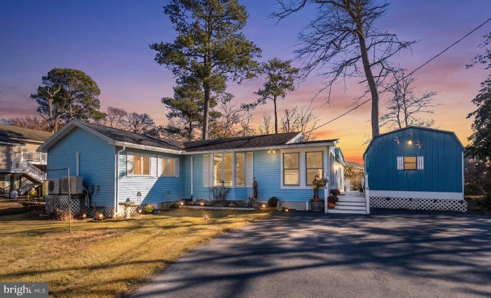 20K BELOW APPRAISED VALUE!
DEEDED PRIVATE DOCK & WATER ACCESS.
Welcome to your beach getaway with a deeded private dock and community boat ramp for bay access. Enjoy beautiful sunsets from this private retreat with no HOA located in close proximity to the Atlantic Ocean.
This 3-bedroom, 1-bath home delivers the ideal balance of privacy and coastal convenience, just minutes from the beach, dining, and everyday essentials.

Inside, the expansive four-season room is the centerpiece of the home, filled with natural light and offering peaceful views year-round. The spacious primary suite offers a comfortable retreat after a day on the water.

Outdoor living shines with a rear deck overlooking a tranquil and private back yard. Cool off in the outdoor shower after a hot summer day. Two storage sheds add functionality for beach gear and tools.