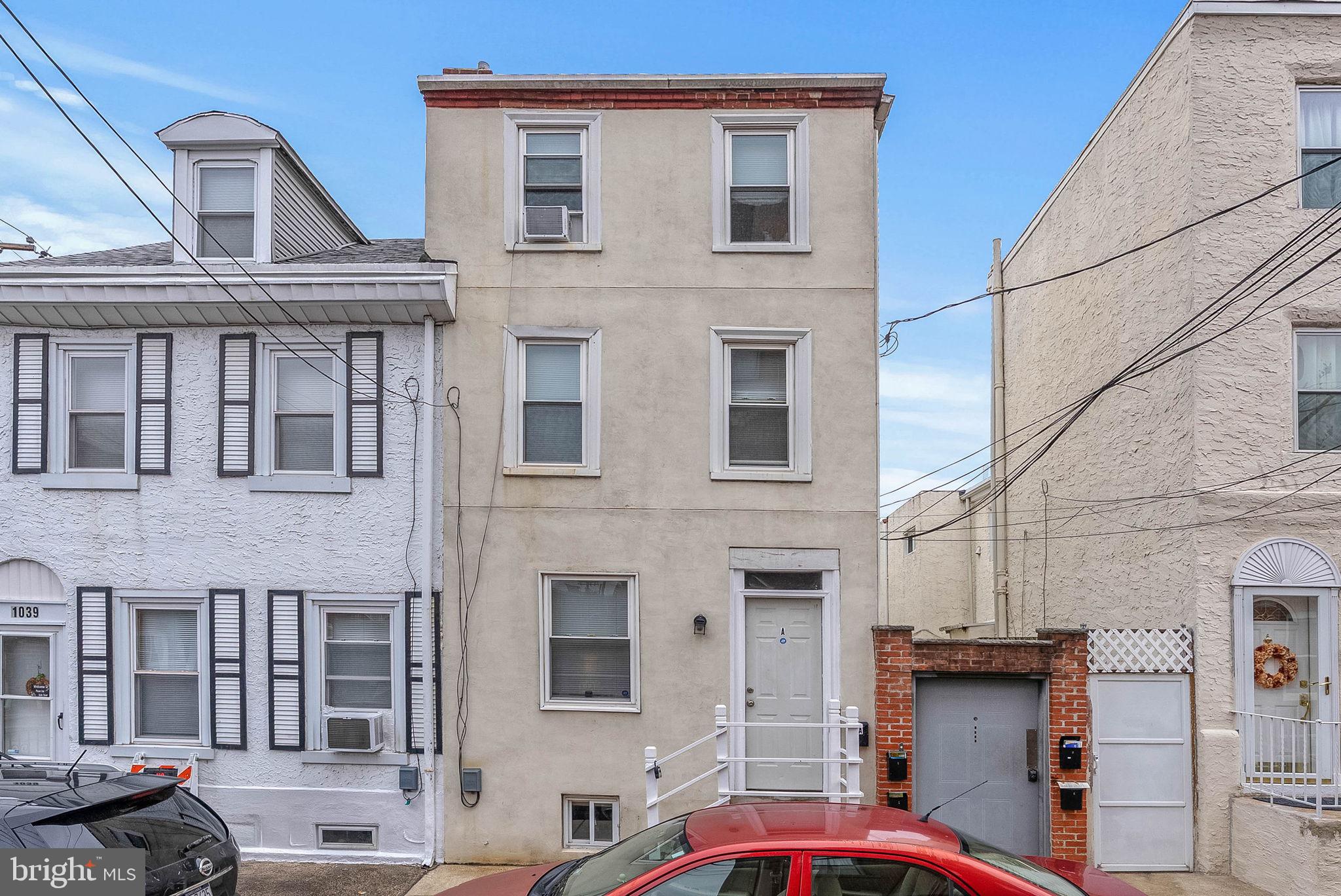 If you are looking for cash flow and location, stop scrolling! Located on a hidden block, just off Girard Ave & Frankford Ave in Philly's booming Fishtown neighborhood, 1037 Crease St offers a rare investment opportunity to own a unique set of 5 occupied, updated, trinity-style rentals. These homes are also deeded separately, so there is the chance of selling them individually in the future. There's one 2-bed, 2-bath unit, four 2-bed, 1-bath units, shared pay-per-use laundry, and an enclosed patio. Unit #A is the 2-bed, 2-bath with a private street entrance opening to a bright living room with modern floors. The lower level features a sleek kitchen fitted with white shaker cabinetry, a full suite of appliances (including a dishwasher), granite counters, a tile backsplash, and a pantry. The two upper levels each boast a sunlit bedroom and a modern full bathroom. A secure breezeway leads to the other units. At the center, #B, #C, and #D have similar layouts with the living room on the first level, the kitchen on the lower level, a bedroom and bathroom on the second level, and a bright, airy bedroom on the third level featuring tall vaulted ceilings and skylights. #E on the end is the largest unit and boasts a private roof deck. A laundry closet and a patio at the rear complete the property. 1037 Crease St's fantastic Fishtown location earns a Walk Score of 87! Popular restaurants, friendly shops, and lively entertainment fill the surrounding streets. Penn Treaty Park, Rivers Casino, and Northern Liberties are also nearby, along with easy access to public transit, I-95, and South Jersey. Schedule your showing today!