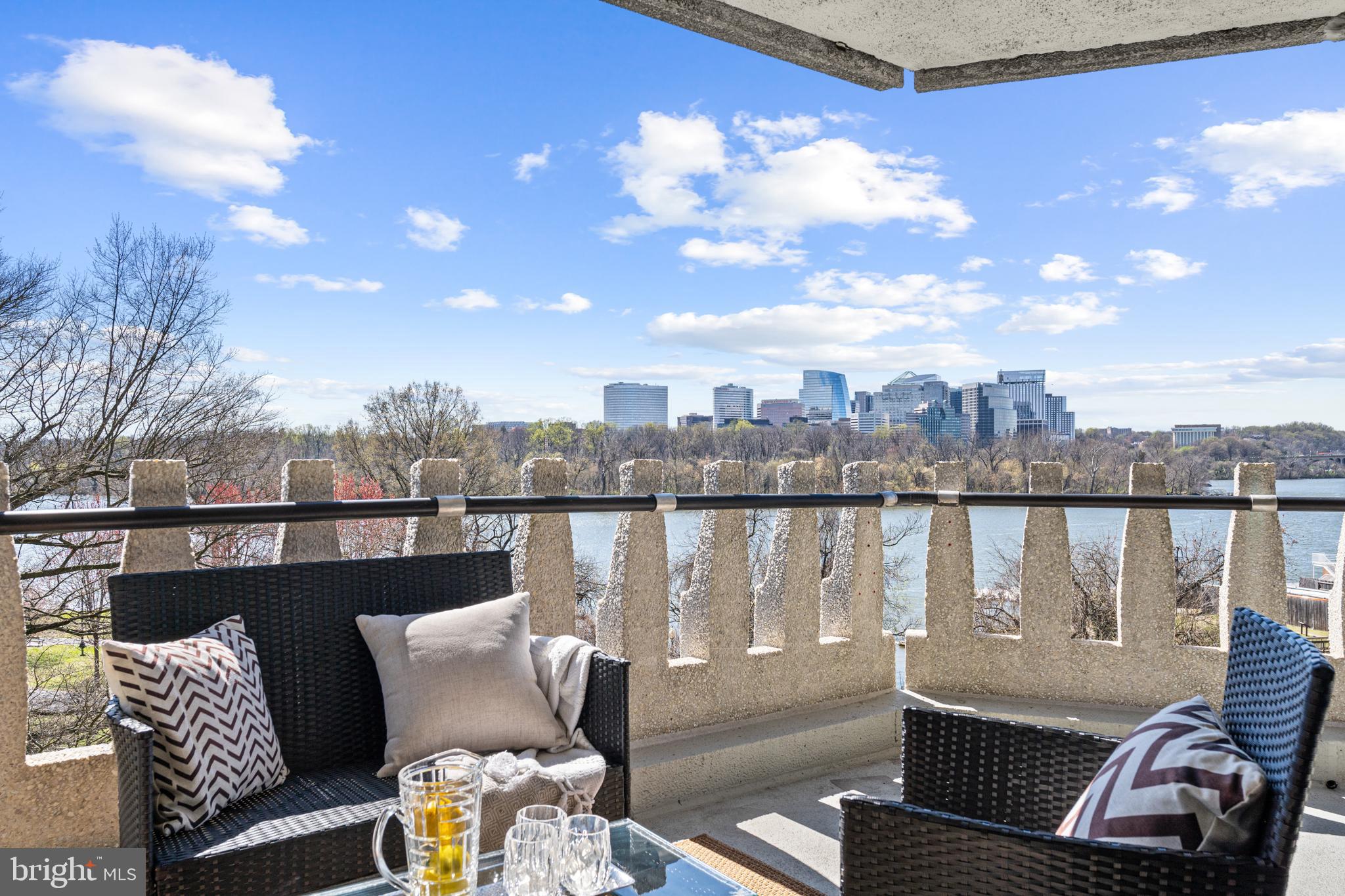 Breathtaking River View, Superb Renovation. 2,740 square foot interior, exquisitely renovated by BOWA Design/Build. Three bedrooms converted to 2 bedrooms and den, 3.5 baths. Over 90-ft full balcony and floor-to-ceiling windows turn the corner and follow the river, across the entire sunny southwest facing interior. Balcony access from every room. A panorama of Potomac River, Key Bridge,  Kennedy Center, Roosevelt Island, and sunset views is matched by the sensational one-of-a-kind interior. The living and entertaining spaces include 4 seating areas. The unforgettable dining space has a woodworking masterpiece crafted ceiling and accent wall in walnut with hidden lighting strips and an Italian glass chandelier. Abundant art space and recessed dimmable and adjustable lighting throughout. Trucor Black Hills Oak flooring throughout. Sophisticated office/den/theater room with pocket privacy doors, Cygnus quartz wall-to-wall bench. Office features a wrap-around desktop in Zeus White quartz, AV easily accessible in cabinets. Gourmet kitchen with quartzite counters - the beautiful Taj Mahal quartzite counters, sitting bar, and backsplash set the stage for the captivating Cobalt Blue quartzite peninsula countertop, waterfall and raised breakfast bar counter. Custom Brookhaven cabinetry and specialty pull-out cabinet with organizer. Appliances include Miele Mastercool II Smart refrigerator, Miele 30" gas range with convection, Miele steam oven with multi-steam technology, Miele dishwasher, Miele dual zone wine storage refrigerator, Zephyr Range Hood, Panasonic microwave Invertor Technology & Genius sensor. Pendant lighting. Pentair Everpure filtered water system. Well-lit pantry with movable shelving and rolling cart. Luxurious primary bedroom with custom draperies, sitting area, Contardi Lighting, wall sconces by King Roselli Architects. Tailored Living closet system. The primary bath features two thermostatic shower systems, Brizo Raincan showerhead and EuroSlide Bar handshower, heated floor and towel warmer, wood vanity, wood surround whirlpool tub with Bubble Massage and IPE wood decking - all will  make you feel like you stepped into a spa. Toto commode. Emil Stonetalk Italian tile floors and surround. Accent wall, vanity counter, and designer floating stone shower benches in Kalahari quartzite. The second bedroom features a Tailored Living murphy bed, and Exercise TRX XMount Anchor. Guest bathrooms with Emil Stonetalk Italian  tile, Zanzibar Marble and Silver Brown Wave Travertine benches, Floating vanity counters in Zeus White quartz. The powder room has a floating  vanity with Basalt stone sink base and pendant lights. Bosch washer/dryer and Zeus White Quartz counters. Double-pane windows have extra 3M Prestige film for art protection and comfort. State-of-the-art smart home features include rock-solid mesh WIFI, CAT6 cables, Samsung TVs with 4K Apple TV, Lutron motorized shades, Eufy doorbell, Netgear switches, and UPS protection. Lutron programmable motorized blinds are in the entertainment areas, custom black-out draperies in bedrooms. Extraordinary closet and storage space throughout, plus additional storage. Underground parking space can possibly hold two cars. $103,000 Building Mortgage is subtracted from the sale price at settlement.!!!Ask agent. Watergate West has undergone terrific and extensive renovations. All inclusive fee includes property taxes, utilities, maintenance of HVAC and basic cable. Watergate West amenities include 24-hour front desk & doorman service, heated outdoor pool, roof terrace, fitness center, beautifully landscaped gardens, plus on-site shops & restaurants. Walking distance to the Kennedy Center, Georgetown Waterfront, Foggy Bottom Metro, Watergate Hotel & Spa, and restaurants.