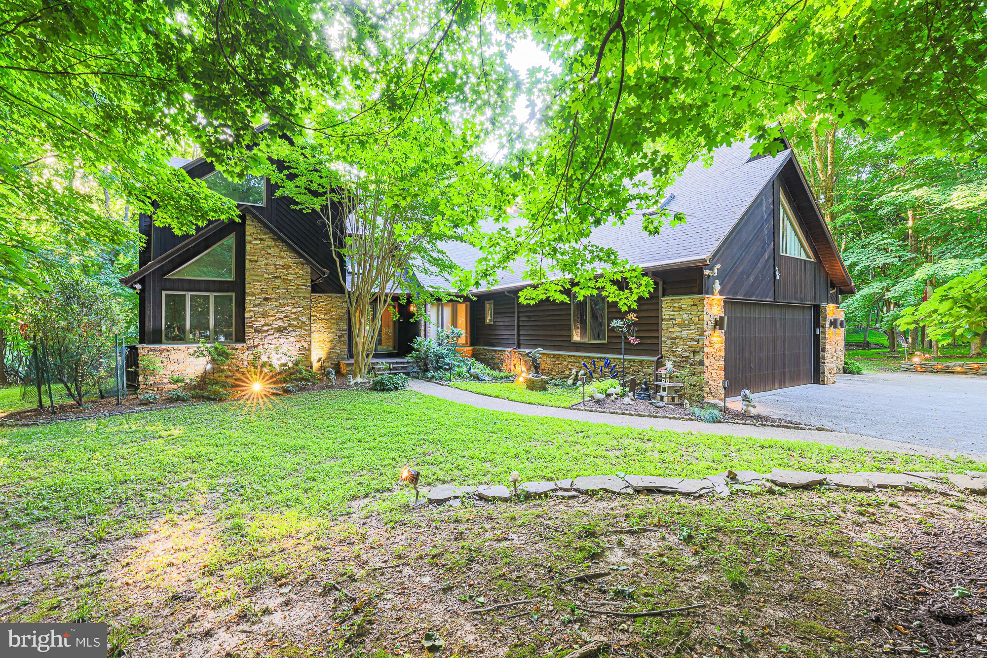 Some homes are built; others are created. Set on 3.5 private acres in the Hunt Valley area, this remarkable custom residence combines dry-stack stone, cedar, and imaginative design to create a home unlike any other. 

Dramatic angles, soaring ceilings, and unexpected architectural details capture interest around every corner. 

With over 7,000 square feet across three finished levels, this home features a walkout lower level, a music studio, a game room, and an oversized primary suite with a cantilevered deck. It also includes  private offices with a separate entrance, smart-home features, and a three-car garage, providing ample space for all aspects of modern living. 

Adding to its charm are whimsical animal sculptures once associated with Baltimore's beloved Enchanted Forest, making this property truly unique. Memorable and magical. A rare opportunity to own a home that simply cannot be duplicated.