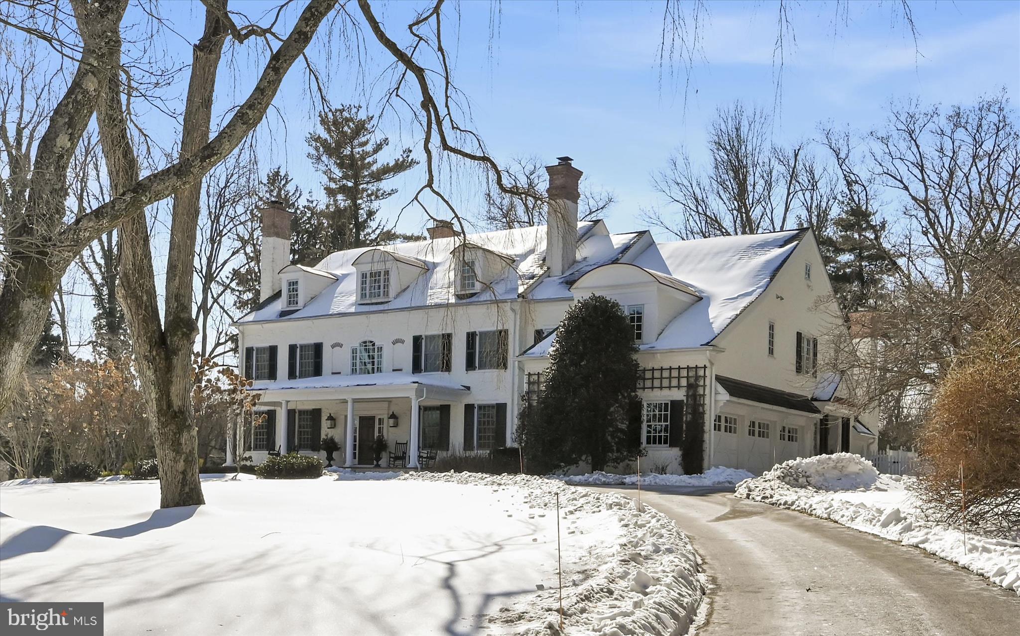 A stately yet inviting Main Line estate, this Ted Babiy Quality Built farmhouse home offers refined luxury living defined by timeless craftsmanship, architectural presence, and exceptional care. Set on a level, fully fenced 2-acre lot within the coveted Leopard Lakes community, the property delivers estate-scale living while maintaining warmth, comfort, and enduring charm. Throughout the home, statement fireplaces serve as striking design focal points, anchoring living spaces with warmth and visual impact. These thoughtfully placed features create the perfect backdrop for cozy winter evenings, festive holiday gatherings, and elegant entertaining, reinforcing the home’s classic yet welcoming character. While expansive in scale, the home is beautifully designed to feel inviting and livable, offering grandeur without sacrificing comfort. The home has been impeccably maintained by its sole owners, reflecting pride of care and thoughtful stewardship at every turn. The first floor is ideally suited for both formal and everyday living, featuring a living room, dining room, sunroom, private study, and expansive family room, each space defined yet seamlessly connected for effortless flow. The chef’s kitchen serves as the heart of the home, equally suited for daily living and hosting memorable celebrations. The home offers 5 bedrooms, 5 full and 2 half bathrooms, highlighted by a serene primary suite retreat with a spa-inspired ensuite bath and an adjoining office, dressing room, or sitting room, creating a private sanctuary within the home. The large, en suite fifth bedroom, which opens to a sitting area, offers options for a live-in nanny or in-laws. An expansive finished basement adds exceptional versatility, ideal for recreation, media, or home gym capabilities, while the walk-up third floor presents an outstanding opportunity for future finished living space. Located in Easttown Township, this home is part of the award-winning Tredyffrin–Easttown School District, consistently ranked among the top school districts in Pennsylvania. Residents of the close-knit Leopard Lakes community enjoy lake access for swimming, kayaking, tennis courts, and year-round community activities, enhancing the lifestyle appeal of this exceptional setting. Conveniently located near major roadways, the home provides easy access to Philadelphia International Airport and is less than an hour from Philadelphia and Wilmington, offering both accessibility and privacy. A rare opportunity to own a stately, impeccably cared-for Main Line home that balances luxury, scale, and year-round livability, from festive holidays to quiet fireside evenings.