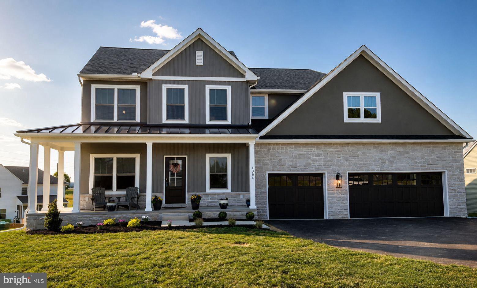 Luxury Living Redefined at 1584 Harrisburg Avenue, Mount Joy. Welcome to an extraordinary residence in the prestigious Garner Estates community, where timeless elegance meets modern sophistication. Perfectly positioned on a beautifully landscaped 0.59-acre homesite, this newly built luxury home offers over 4,300 square feet of impeccably finished living space designed for both refined entertaining and everyday comfort. Step inside to discover a breathtaking two-story family room adorned with dramatic coffered ceilings, abundant natural light, and a striking two story stone gas fireplace that creates an unforgettable first impression. The heart of the home is a chef-inspired gourmet kitchen featuring quartz countertops, an oversized island, premium stainless steel appliances, gas cooking, and an expansive walk-in pantry—perfectly blending beauty and functionality. The luxurious main-level owner's suite offers a peaceful retreat with a spa-inspired bath, soaking tub, and spacious walk-in closet. A private office, elegant formal dining room, and convenient first-floor laundry complete the thoughtfully designed main level. Upstairs, three generously sized bedrooms, two full baths, and an open loft overlooking the great room provide exceptional flexibility for family and guests. The finished walkout lower level extends the home's living space with a large recreation room and full bath, ideal for entertaining, overnight guests, or a private fitness studio. Outdoor living is equally impressive. Relax on the covered front porch, entertain on the maintenance-free composite rear porch, or enjoy the professionally landscaped grounds that frame peaceful Lancaster County views. A spacious three-car garage completes this exceptional offering. No detail has been overlooked, including more than $18,000 in professionally designed custom blinds that elevate the home's luxurious aesthetic while offering exceptional privacy and light control. Ideally located just five minutes from a selection of shopping, restaurants, cafés, grocery stores, and everyday conveniences, placing everything you need within easy reach. Blending luxurious finishes, thoughtful design, and an unbeatable location, 1584 Harrisburg Avenue delivers an elevated lifestyle where elegance, comfort, and craftsmanship come together beautifully. This is more than a home—it's a statement of exceptional living