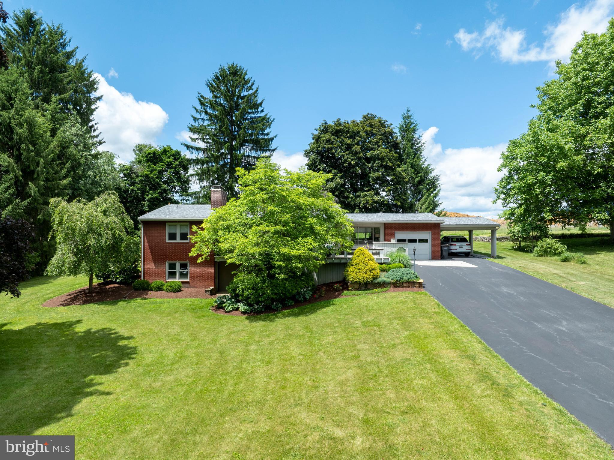 Welcome to this well-maintained 3 bed, 2 bath Mid‑century home tucked away in a fantastic location, with the newly expanded Mount Nittany Elementary just moments away. This is an excellent opportunity for true one‑floor living, offering a flowing floorplan and bright, open spaces throughout! A desirable main‑floor primary bedroom adds everyday convenience. The dining room, kitchen, and breakfast area overlook the gorgeous multi‑tiered garden, backyard patio, and mature trees. A stylish full bath features upgraded countertops, dual sinks, and a tiled walk‑in shower. The living room is anchored by a cozy wood‑burning fireplace and a large picture window framing beautiful views. You’ll appreciate the generous pantry closets and the main‑floor office with built‑in desk and shelving—perfect for a work‑from‑home setup or creative hobbies. The finished lower level provides an expansive family room with integrated shelving, a gas fireplace, and abundant natural light. An oversize walk‑in closet offers excellent storage. A Jack‑and‑Jill bath connects the two lower‑level bedrooms, and an additional storage room houses utilities and laundry. A second laundry hookup is also available in the main‑floor office for added flexibility. Privately tucked away yet close to everything Boalsburg and State College have to offer, this home blends comfort, convenience, and a truly special setting.