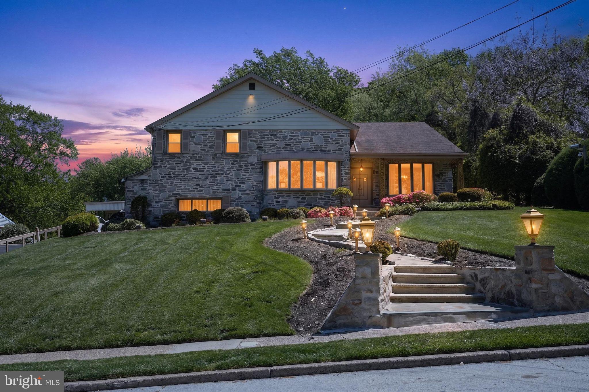 Welcome to 1912 Cobden Rd — a spacious 4-bedroom, 4-bath home tucked into desirable Laverock and built for entertaining. The backyard is the showstopper: a large in-ground pool surrounded by an expansive patio with room for a crowd, a covered rear deck for shaded gatherings, and mature landscaping creating a private retreat. Inside, multiple living spaces flow across two levels — a vaulted-ceiling formal living room with bay window, a separate formal dining room, an eat-in kitchen, and a generous family room with fireplace. The lower level is the entertainer's prize: a full custom bar, lounge seating, and rec space that turns ordinary evenings into events. Covered carport plus attached garage round out a home offering generous proportions, exceptional indoor-outdoor flow, and unmatched entertaining capability.