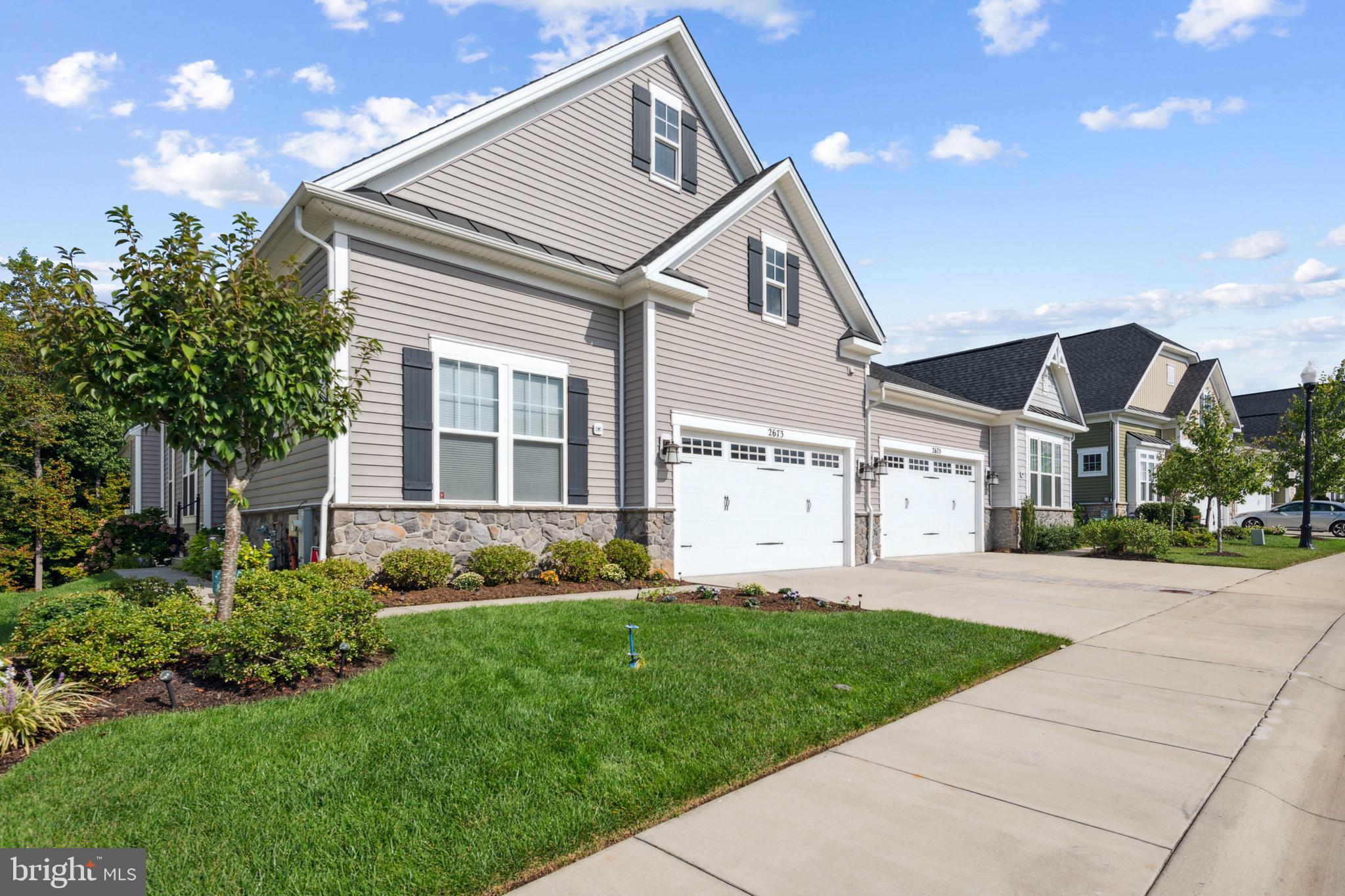 Look no further, we've found the place that you've been dreaming of! Experience the epitome of comfortable and convenient living in this three-bedroom, three-full bath haven nestled at 2673 Dragon Fly Way in the sought-after 55+ section of Two Rivers, Odenton, MD. The heart of the home boasts a well-appointed gourmet kitchen with stone counters, stainless steel appliances, gas cooking, and a spacious pantry. Step into an oasis of tranquility as you unwind on the generous screened porch just off the great room, offering breathtaking views of woods and a soothing walking trail. The bedrooms are a true zen retreat, with plush carpeting in soft neutral colors to promote restful sleep, and ceiling fans to provide comfort year-round. Lower level features a huge recreation room, full wet bar, full bath and a massive guest room for your guests comfort. With a two-car garage complete with storage shelves and a lawn irrigation system, every detail has been thoughtfully designed. Within this vibrant community, enjoy a plethora of amenities tailored to enrich your lifestyle. A 55+ only clubhouse beckons with its indoor/outdoor pool, game room, and fitness center, offering a space to connect and unwind. Community pickleball and tennis courts, along with walking trails, ensure endless recreational opportunities. Lawn and snow maintenance are thoughtfully included in the HOA. Welcome to a new chapter of living that embraces both comfort and luxury. Make 2673 Dragon Fly Way your address in the heart of the Two Rivers community.