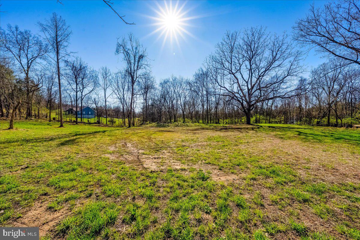 The true value is in the land—an exceptional opportunity to own 2.44 secluded acres in a serene country setting. This beautiful, partially wooded lot offers the perfect blend of privacy, natural surroundings, and open space, creating an ideal backdrop for your custom dream home. With well and septic systems already installed, much of the initial work has been completed—providing a seamless path to bring your vision to life. Whether you’re looking to build now or invest for the future, this property offers endless potential in a peaceful, sought-after setting.