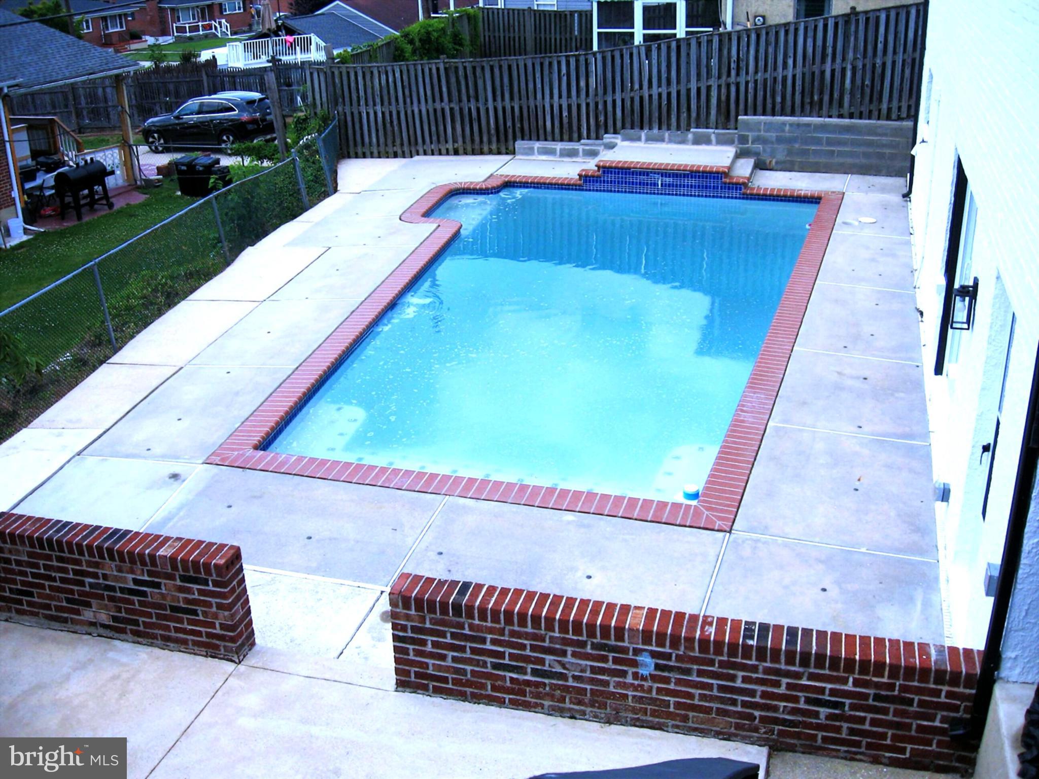 Welcome to this well-appointed two-level rancher that has been updated throughout. To note just a few updates to include quartz counter tops, new stainless-steel appliances, subway backsplash, pendant lighting, recessed lighting, all new vinyl flooring on main and lower levels, some new windows, completely renovated full bath on the main level.  The fully finished expansive lower level offers a full bath, a large possible 4th bedroom and a built-in wine bar that can be used to provide refreshments to guests that are enjoying the 32x16 inground pool that is located just outside of the new sliding glass basement doors. Guest or family that are not enjoying the inground pool might be enjoying the large 16x28 deck that's located just outside the kitchen door.  1214 48th St is a property that will serve in making memories that families will cherish for years to come. Seller offering a one-year home warranty not to exceed $650.