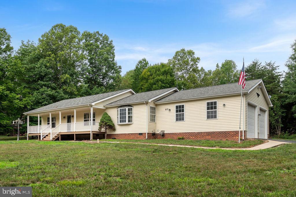 Welcome to this like-new, beautifully renovated water-access home in the highly sought-after Tall Pines subdivision at Lake Anna, just minutes from the Common Area located on the Public Side. Thoughtfully updated throughout, this home features three spacious bedrooms, each with a private en-suite bath, offering comfort and flexibility for family and guests. The open and inviting floor plan includes a large living room, formal dining area, and a stunning kitchen complete with a center island, granite countertops, and quality finishes throughout. Whether you're entertaining or enjoying a quiet evening at home, this space is designed for everyday living.  Outside, you'll appreciate the oversized two-car garage, paved driveway, and additional storage area behind the shed that's perfect for a boat, trailer, or extra vehicles. Best of all, the home is located just a short distance or golf cart ride from the community common area and your assigned boat slip, making it easy to enjoy everything Lake Anna has to offer. Tall Pines offers exceptional community amenities, and this prime location puts you just minutes from grocery stores, restaurants, shopping, marinas, wineries, breweries, and the growing entertainment options around Lake Anna. Whether you're searching for a full-time residence, weekend retreat, or investment property, this move-in-ready home is an outstanding opportunity to embrace the Lake Anna lifestyle.