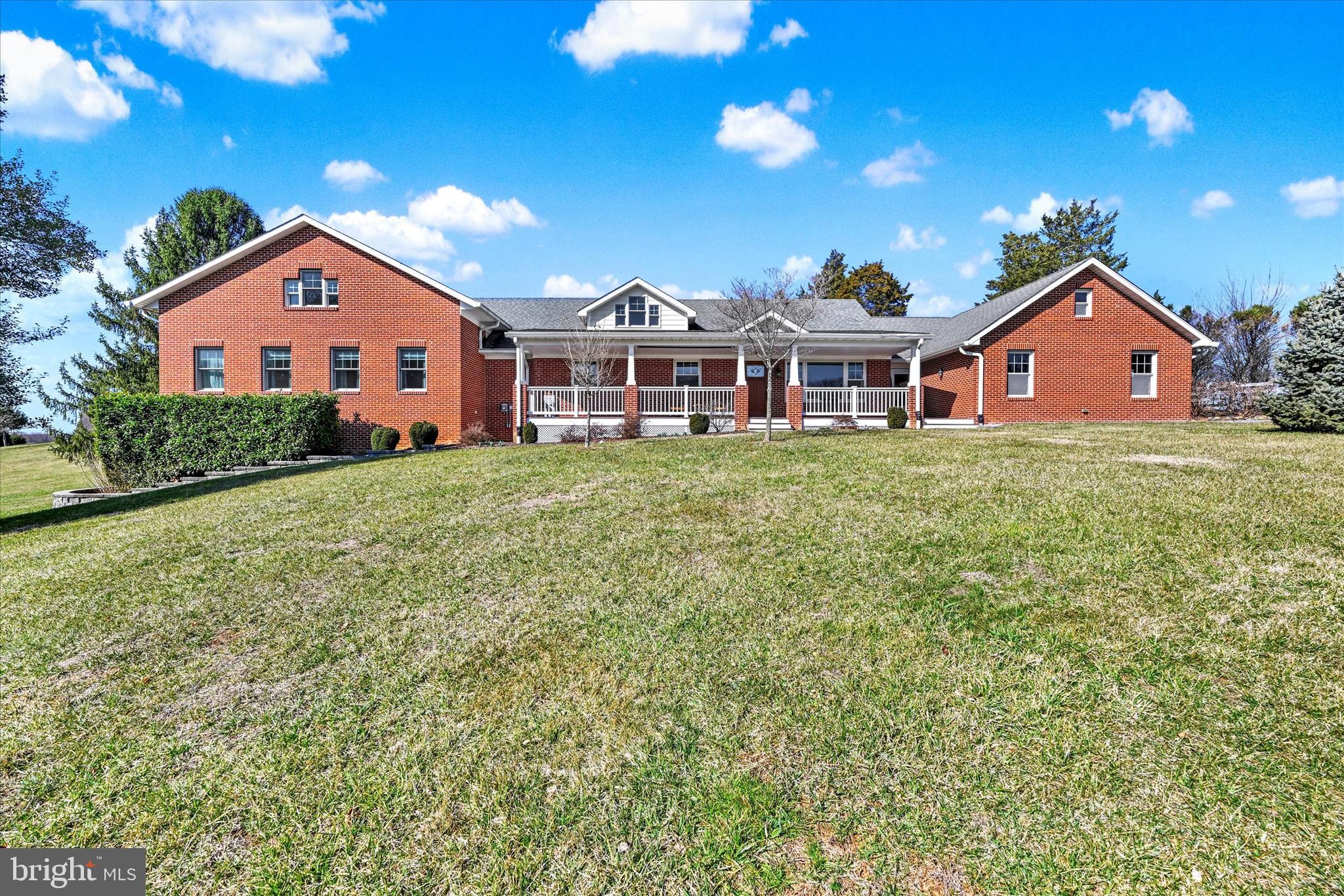 Nestled in the heart of Western Howard County, this incredible property offers a perfect blend of serene countryside living with modern comforts. Sitting on 8 beautifully landscaped acres this home is ideal for those seeking privacy, space and convenience..  This Classic brick home with welcoming  front porch  was seamless expanded in 2015 including Primary Bedroom/custom walk-in closet and  Glam Bath- 2 Story Great Room with Wood Stove-Laundry Room- 2nd Level and Basement also expanded. Kitchen with Granite Counters, Stainless Steel Appliances, Double wall oven, Microwave, Cooktop. Large pantry cabinet and breakfast area. Window over the sink with views of the farm! Generously sized Dining Room perfect for hosting special occasions or everyday meals. Main level also features 2 additional bedrooms and a full bath.
 The  upper level boasts 2 generous bedrooms, a full bath, a bonus flex area perfect for hobbies, home office or a cozy study area complete with a window seat.  The 2 car side entry garage provides entrance to the kitchen via a large breezeway with a door from the patio.  Large Pole Barn could have stalls again! Also Loafing Shed and extensive fencing. Home Solar Energy System owned and conveys with the sale, Geo Thermal heat pump system also -- no worries about high utility Bills!!  Full basement offers extensive workshop space,  plenty of room for a Home Gym, and additional storage potential. Prime location near 94 this property offers convenient access to Route 70 and nearby towns of Mt. Airy, Frederick Damascus and Olney. Enjoy the perfect balance of rural tranquility with urban accessibility. Don't miss the exceptional opportunity to own a beautifully maintained and expanded home on a picturesque 8  acre property. Schedule your showing today!