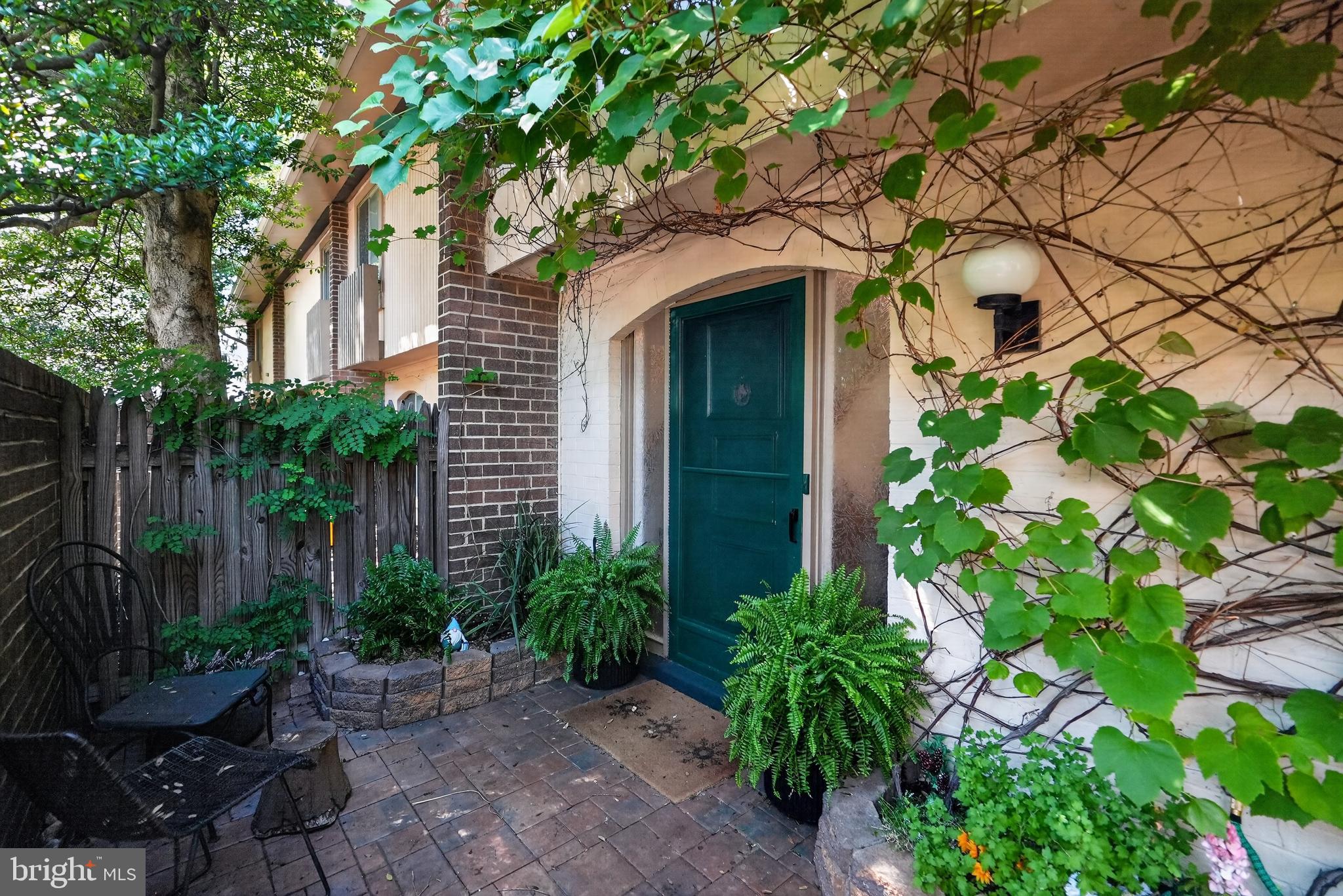 Welcome to this striking 3-bedroom, 2.5-bath contemporary townhouse in the Thomas Choice Condominiums, ideally located with easy access to Lake Whetstone, its scenic walking trails, and marina. Step inside to discover fresh paint, updated flooring, and abundant natural light that fills the open and inviting main level. The chef's kitchen impresses with ample cabinetry, granite countertops, and stainless steel appliances, including an electric cooktop, wall oven, built-in microwave, and a French door refrigerator equipped with a filtered water dispenser and ice maker. A spacious living room showcasing high ceilings, a cozy wood-burning fireplace with a stunning stone surround, dramatic floor-to-ceiling windows, and direct access to the rear patio, create a seamless connection between indoor and outdoor living. Overlooking the living area, the dining room offers an inviting setting for everyday meals and special gatherings. A convenient powder room and laundry area complete this thoughtfully designed main level, perfectly suited for both comfortable living and effortless entertaining. Upstairs, the primary suite is a true retreat with wide plank flooring, a walk-in closet, and a spa-inspired en suite bath with a dual sink vanity and beautifully tiled walk-in shower. Two generously sized secondary bedrooms with ample closet space, along with an updated full bath, complete the upper level. Step outside to enjoy your own private outdoor oasis. Relax beneath the shade of a charming grapevine covered private entry or entertain in the beautifully fenced backyard featuring lush green space, string lights, a sandbox, and a built-in grill. Mature trees provide abundant shade, creating the perfect setting for summer BBQs, outdoor play, or simply unwinding in a peaceful atmosphere. All updates done with high-quaility materials and recently installed insulation in the attic with energy efficient barrier offering incredible storage space. HVAC and water heater replaced in 2023. Two assigned parking spots near the unit entrance, plus additional guest parking nearby. Condo fee includes water, trash, snow removal, lawn care, and exterior maintenance, including the roof, fascia, and gutter cleaning. Residents enjoy access to exceptional community amenities, including a neighborhood pool, tennis courts, basketball courts, and playgrounds. Ideally located, this home offers easy access to I-270 and Route 355, and is just minutes from the Whetstone community pool, local parks, ALDI, Lidl, and Starbucks. Don't miss this rare opportunity!