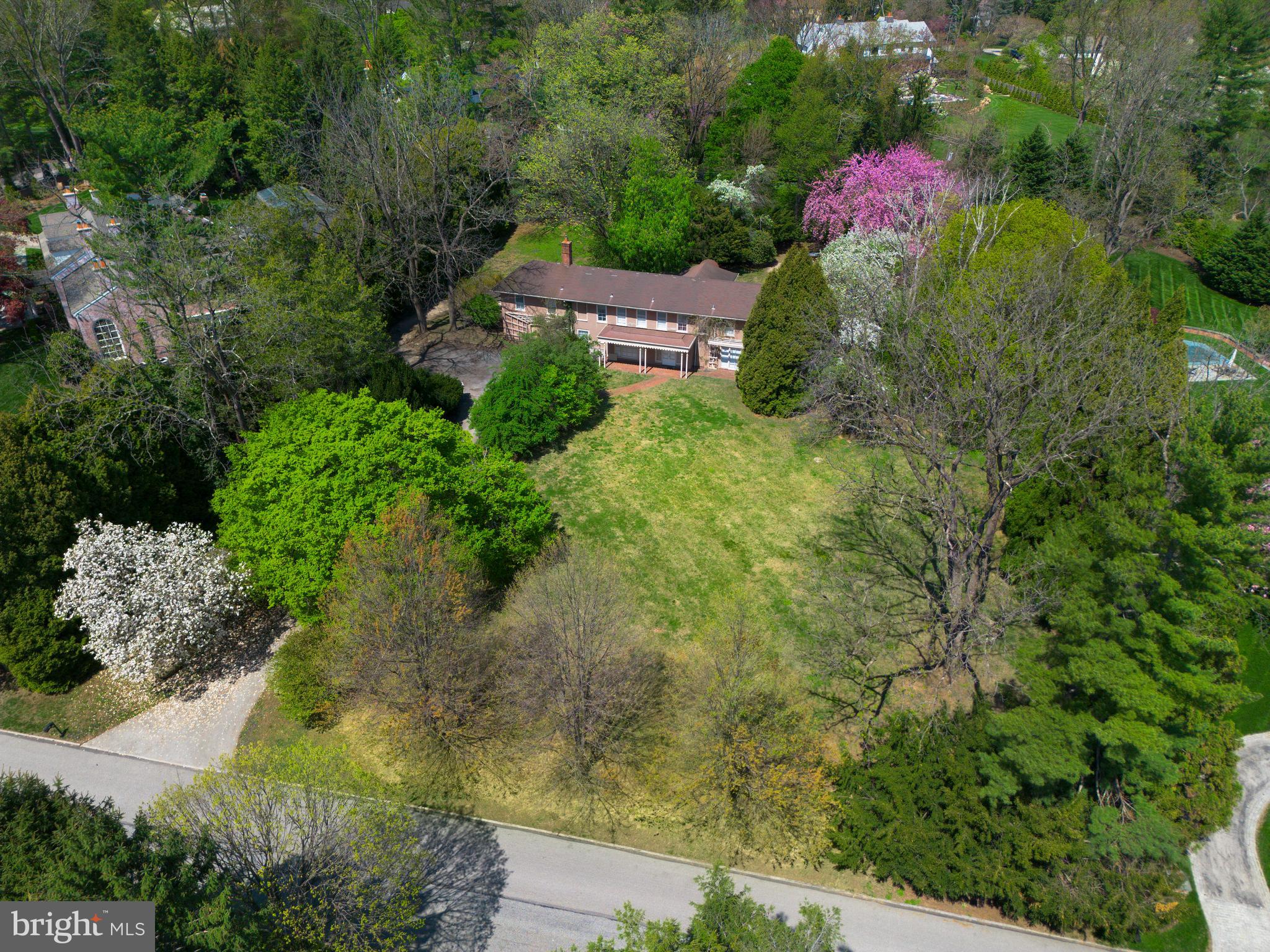 Located on one of north-side Villanova’s most prestigious and sought-after streets, 1114 Brynlawn Road offers a rare opportunity to restore or reimagine a classic Main Line estate.

Set on 1.35 level acres with expansive frontage and an in-ground pool, this 7-bedroom, 5.5-bath Walter Durham residence is surrounded by some of the area’s most significant homes. The street forms a quiet, two-road circle with virtually no through traffic—an ideal setting for privacy, serenity, and long-term value.

The home’s traditional layout features a wood-paneled foyer, a spacious living room with fireplace, and a beautifully proportioned dining room with built-in china cabinets and French doors that open to the rear grounds. The galley-style kitchen adjoins a mudroom and laundry area, while a cozy den with built-ins provides a quiet retreat. A powder room and unfinished basement complete the main level.

Upstairs, seven bedrooms with hardwood flooring and five full baths offer remarkable space and flexibility for family living or future redesign. The home’s footprint and the generous, level lot easily support a substantial addition or expansion.

Central air is in place, but the home will require extensive renovation to reach its full potential. Whether preserved and restored or fully transformed, 1114 Brynlawn Road presents a rare chance to own a legacy property in one of the Main Line’s most exclusive locations.