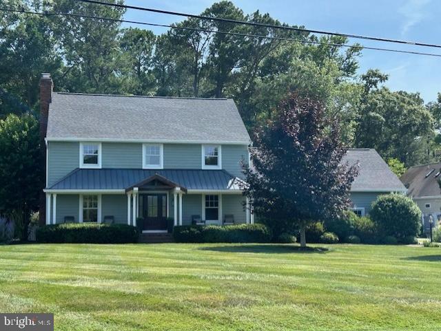 Seller is getting the home and property ready for your enjoyment soon. Classic Cape Cod with a delightful Sunroom added recently. View of the Ocean City Yacht and Country Club and a short walk to the Clubhouse and Pro Shop. Just painted, new carpet and LVP installed. New roof and gutters in Fall of 2024 and well and septic maintained and serviced regularly. The majority of the windows done by Renewal by Andrson in 2025. Gracious Family Room with wood burning fireplace. And the surprise in the back yard- a dock with kayak, canoe or SUP waterfront availability to Gibbs Pond and Newport Bay.  All you could ever want in your new home. New countertops in kitchen and bar area to be installed shortly. Easy to see.