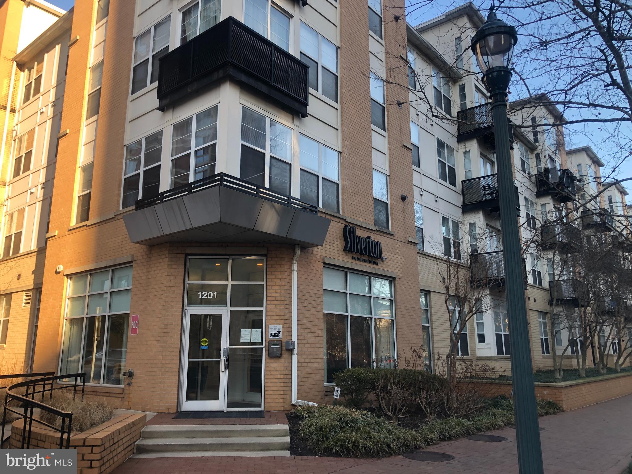 This is a rarely available corner unit on the 2nd floor with 2 SEPARATELY DEEDED PARKING SPACES (78, 245)! Inspection completed and condo is move in ready!  You will agree that this fabulous unit has so much more space than your average condo and is located in an amenity rich building.  Boasting 3 bedrooms, 2 full bathrooms and all upgraded for your comfort and peace of mind.  Recent upgrades include the HVAC and Hot water heater (both replaced summer 2025).  As you enter this spacious, open layout, the gleaming wood floors welcome you.  The kitchen shines with granite counters, stainless steel appliances, gas stove, 42" wood cabinets, tile floor, pantry, glass tile backsplash and convenient island.  The primary bedroom is beautifully light filled with wood floors, 2 windows and includes an enormous walk-in closet with specialty designed built in shelving.  The luxurious connecting primary bath has granite counters, oversized mirror, a stand up shower and modern tile flooring.  Bedroom 2 also enjoys light from 2 windows, has gorgeous wood floor and has a large closet.  The adjacent lovely bath has a tall vanity with granite counters and a large serene soaking tub.  The 3rd bedroom features wood flooring and also has an oversized walk-in closet.  Uses for this room include playroom or office space.  The laundry closest provides the utmost convenience with a full-sized washer and dryer in the unit.  The cute balcony off of the living room overlooks one of the beautifully landscaped courtyards, a peaceful area to enjoy nature.  The Silverton was built in 2006 on the site of the former Canada Dry bottling plant, and offers an outdoor pool, on site management, a party room, a fitness center, and on site dog run for your pets, landscaped courtyards and a large outdoor plaza with seating and local community activities.  The Silverton is a strong fulfilling community that includes Yoga classes, book club, composting group, rooms (near pool with kitchen) that can be reserved for private events. The building is located right next to a public bus stop and a few blocks to the Silver Spring Metro, not to mention such a short distance to downtown Silver Spring to enjoy shopping, entertainment, varied restaurants, community events, coffee shops, and so more.  This opportunity to live in one of the best developments in the area doesn't come along very often, so schedule your private tour today!