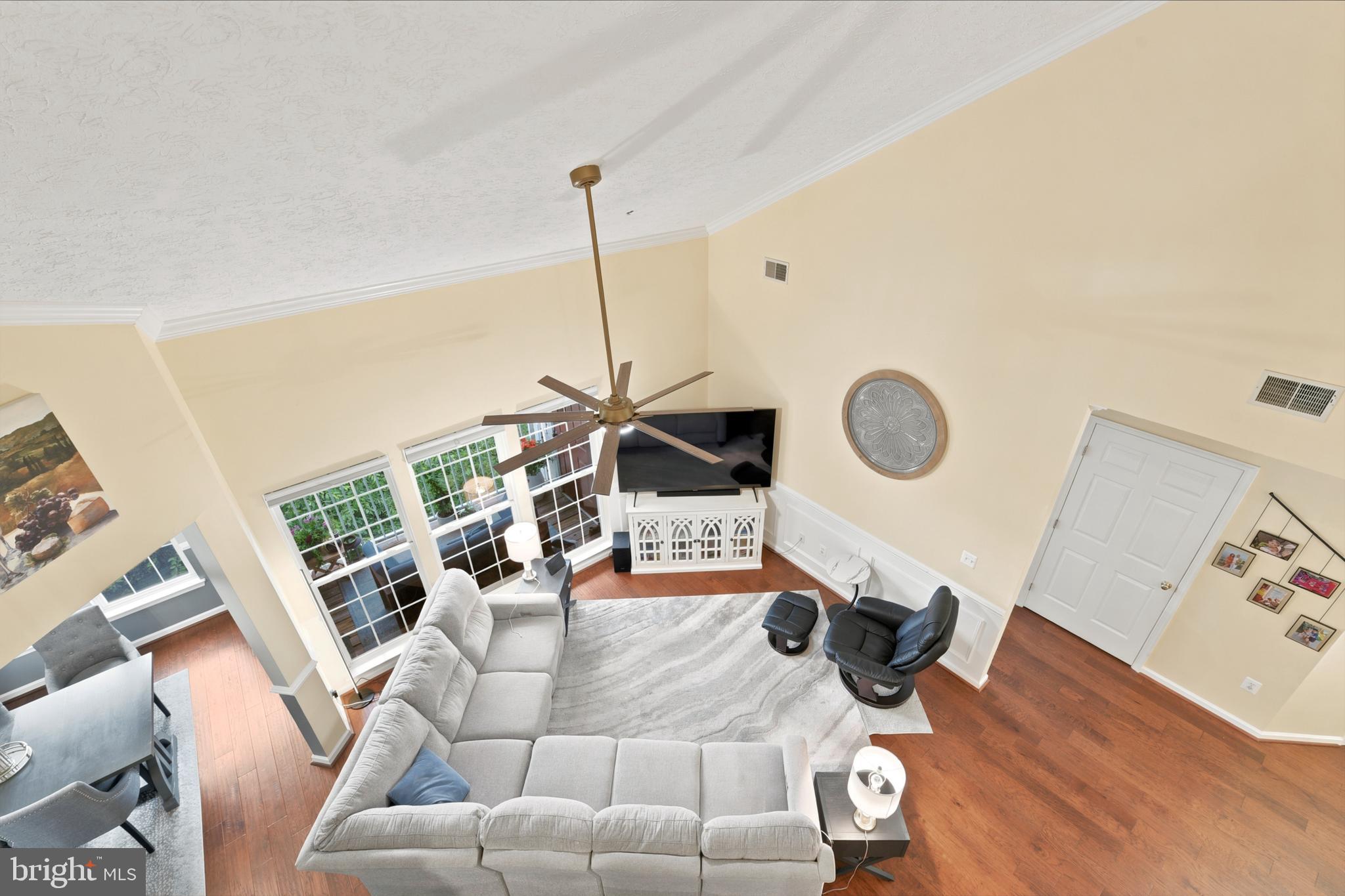 Rarely available third-floor loft condo in the highly desirable Perry Hall Farms Garden Community! This spacious condo offers a unique and versatile floor plan with soaring ceilings and a loft overlooking the living room, perfect for a home office, exercise room, media room, guest suite, or additional living space. The private setting backs to open space and a wooded area for added tranquility.

The thoughtfully designed layout features two generously sized bedrooms, each with its own full bath and located on opposite sides of the unit for maximum privacy. The bedroom is spacious with plenty of room for a king size bed and dressers. and a walk-in closet and an additional closet. The primary bath was beautifully renovated in 2019 with a new shower, double vanity, toilet, and luxury vinyl flooring. The second bedroom offers a spacious closet and convenient access to its own full bath with new engineered hardwood floor.

The kitchen features 42-inch cabinetry, a separate pantry, and all appliances are included. New quartz counters and backsplash have just been added. Additional highlights include engineered hardwood flooring throughout the main level, new carpet in the loft, in-unit washer and dryer, rear deck, mechanical/storage closet, gas heat, gas water heater, and gas range. Major updates include HVAC (2019), water heater (2019), washer and dryer (2020), and refrigerator (2021).

Enjoy the convenience of elevator access, a secure building entrance with intercom system, one assigned parking space, and ample overflow parking. Ideally located near Honeygo Village Center, I-95, I-695, and Route 43, offering easy access to shopping, dining, and commuter routes. This exceptional condo combines space, privacy, and convenience in one of Perry Hall's most sought-after communities.
