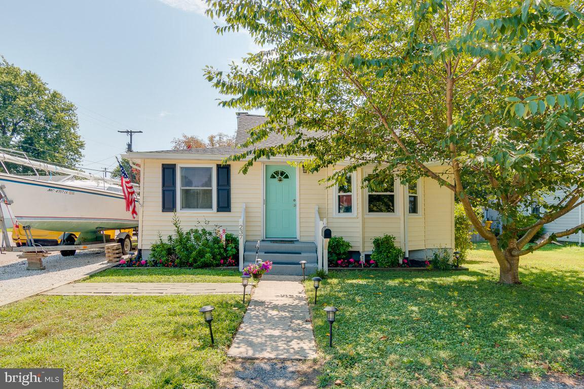 Charming and cute with upgrades to include new Roof, New Flooring, New Bay Windows and Renovated Bath. Great back yard with privacy fence, perfect for entertaining. Walk to community beach.  Centrally located to major routes, shops, restaurants, DC, Baltimore, Annapolis.