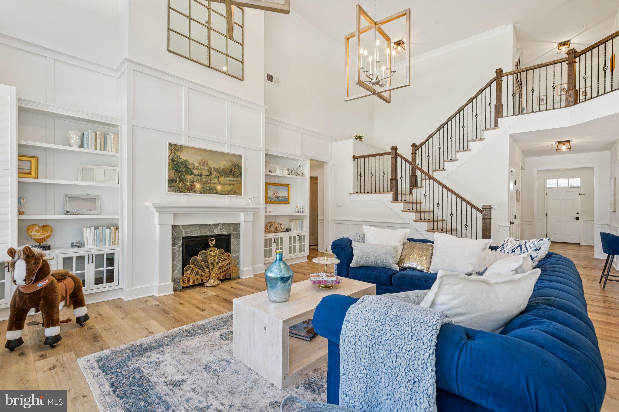 FAST SETTLEMENT AVAILABLE! Welcome to 305 Baratheon, a stunning and uniquely upgraded home in Bel Air's sought-after Eva Mar neighborhood. This is not your standard new construction; it is a true designer house, meticulously crafted with over $300,000 in custom finishes and upgrades, setting it apart as the most luxurious residence in the community. Every detail has been thoughtfully considered to elevate this home from a house to a masterpiece.

Step inside and be greeted by a home that exudes sophistication and warmth. Luxury vinyl plank flooring flows seamlessly across all three levels, complemented by an unprecedented amount of custom trim work. With over 250 feet of wainscoting, shiplap in all bedrooms, and custom casing around all windows, doors, and openings, the craftsmanship is simply unparalleled. The aged bronze hardware, including lights, faucets, and door pulls, creates a cohesive and elegant aesthetic throughout.

The heart of the home is the gourmet kitchen, part of the highest "Garden" package from Keystone. It features Kinsdale painted cabinets, a butler's pantry, and a custom solid wood range hood with a ceramic backsplash and marble centerpiece. Upgrades include a stainless steel gas cooktop, quartz countertops, a vented concave range hood, and a 9-foot sliding door leading to the deck. The appliances are top-of-the-line, including a Samsung Bespoke 4-door flex refrigerator and a Bosch dishwasher.

The two-story family room is a true showstopper, featuring a gas fireplace with a custom surround and built-in shelving, two stunning pendant lights, and a dramatic wall of windows that floods the space with natural light. The primary suite is a private sanctuary, boasting a custom 12-foot vaulted ceiling, a second gas fireplace, and a luxurious Venetian bath package with a freestanding tub, walk-in tile shower with dual shower heads, and quartz countertops.

Further highlights include custom plantation shutters on all windows, a solid oak stair railing with metal balusters, and a beautifully finished 9-foot basement with eight windows and twelve recessed lights, offering endless possibilities for additional living space. The private backyard features a pressure-treated wood deck with composite vinyl decking and black aluminum railing, a white vinyl privacy fence, and an open area for play.

Located just a short walk from the future Harford Academy and Elementary School (coming 2028), this home offers both a serene retreat and a convenient location. With a comprehensive list of upgrades that includes a two-stage whole-house water filtration system, a custom playhouse, and an insulated garage, this home is truly in a class of its own. Experience the pinnacle of custom design and luxury living at 305 Baratheon. Schedule your private showing today and prepare to be captivated.