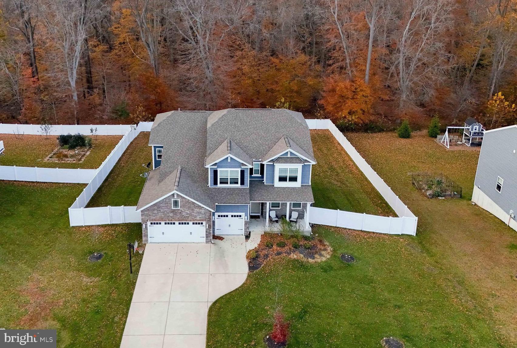 Don't think new until you tour this stunner, just under 4 years old !  6 Bedrooms ! This home  has all the bells and whistles!  This home has over  5,500 sq. ft  of finished living space.  3 Car garage  what a dream home!
This stunning two-story residence features six bedrooms, four bathrooms, butlers pantry,  a loft, sunroom, office, and a three-car garage and completely finished lower level.
The foyer invites you past the formal living room and coat closet, leading into the heart of the home — a well-designed kitchen showcasing a large island, abundant classic white cabinetry, stainless steel appliances, and a walk-in pantry and butlers pantry. The kitchen flows seamlessly into the informal dining area, sunroom, and great room, perfect for entertaining or relaxing.
A spacious secondary bedroom with a large closet and a full bathroom is conveniently located down the hall from the great room — ideal for guests or multi-generational living. For added convenience, a second coat closet sits in the mudroom  at the entrance to the three-car garage.
Upstairs, a large loft area provides flexible living space alongside four additional bedrooms. The owner’s suite is a luxurious retreat, featuring two expansive walk-in closets, a double-bowl vanity, a soaking tub, and a luxury walk-in shower. The laundry room is located on the upper level for convenience, along with another full bathroom complete with a linen closet and double-bowl vanity.
The finished lower level offers even more living space, including a recreation room, an additional bedroom and full bathroom, plus a spacious office area and a walk-out exit door.
Step outside and relax in your fully fenced backyard, featuring a two-tier composite deck and a patio area — perfect for entertaining or enjoying peaceful evenings outdoors. 
This home truly has all the bells and whistles. — Full yard irrigation system, remote blinds,  beautifully design, meticulously maintained, and move-in ready!