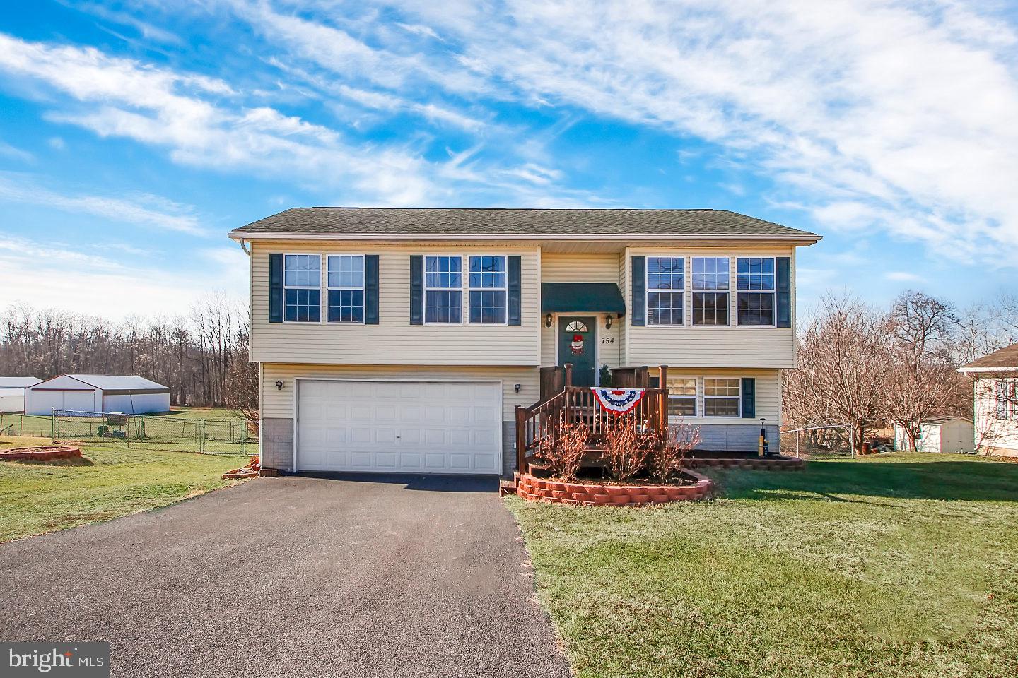 Own your own Gettysburg Address! Move in ready 3 bedrooms, 3 bathroom split foyer. Master bedroom includes a private master bath. Comfortable living room with large picture windows to enjoy the view. Lower level family room includes exercise area or room for an office. The family room also offers a luxurious bathroom with a large whirlpool tub. Spacious 2 car garage with extra room for storage. The private back yard is fenced in with 2 patio areas and fire pit. Great commuter location, easy access to Route 15 and less than 10 minutes to the Square for relaxation! Don't miss this one!