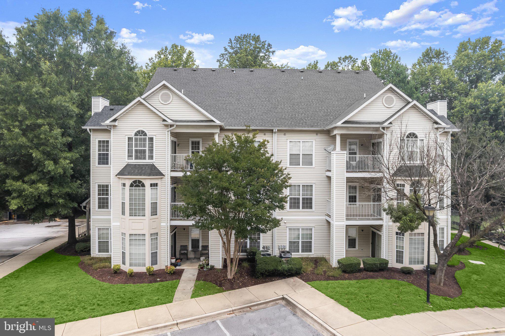 Enjoy low maintenance living in the desirable Bowie Town Center community, where an open floor plan, abundant natural light, and a prime location come together. Stylish plank flooring, installed in November 2023, and a neutral color palette create a fresh, cohesive feel throughout the home.

The inviting living room is anchored by a cozy fireplace and flows seamlessly into the dining room, making everyday living and entertaining effortless. Surrounded by windows on three sides, the dining area is filled with natural light and showcases a soaring ceiling, Palladian window, transom windows, and a sliding glass door leading to the private deck.

Designed with both style and function in mind, the kitchen features ceiling height cabinetry, granite countertops, and stainless steel appliances, including a gas range and a dishwasher replaced in 2022. The refrigerator and stove were also updated between 2018 and 2021.

Retreat to the spacious primary suite, complete with a walk-in closet and an en-suite bath offering a soaking tub and shower combination. A second bedroom, a full bath with an updated vanity, and a convenient laundry closet complete the well-planned interior. Additional peace of mind comes from major system updates, including an HVAC system replaced by the current owner and a water heater installed within the past month. Just outside the front door, a dedicated storage room to the left provides valuable space for seasonal items and everyday essentials.

Residents enjoy a highly convenient lifestyle with a neighborhood pool and easy access to Bowie Town Center, home to an array of shopping, dining, fitness options, and year-round community events. Nearby Allen Pond Park offers playgrounds, picnic areas, trails, paddle boats, an ice arena, and a skate park, while golf courses, sports fields, and recreation programs provide even more opportunities to enjoy the outdoors.