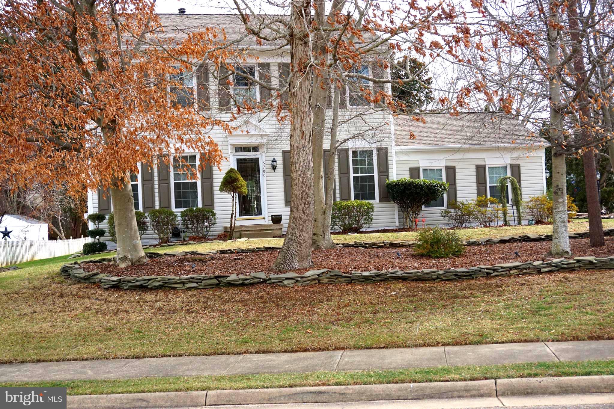 Don't miss out on this stunning 3 level home with 5 bedrooms, 3.5 baths, and over 3,100 square feet of  finished space  located in the Winding Creek Estate subdivision  just off Minnieville Road. This home has been lovingly maintained, and it shows from the moment you walk in.  The main level greets you with a grand entrance as you enter the foyer, where the home truly shines, with gleaming hardwood floors throughout, a private office  and an open-concept layout that flows effortlessly from room to room.  On the main level there is an office, living room,  dining room, family room with a gas fireplace with a blower that was recently serviced,  half bath, laundry room and  kitchen, with granite countertops.  The deck off of the kitchen  leads to an inviting  rear yard.  Custom underground lawn sprinkler system and  a huge shed.  The hardwood staircase leads upstairs to 4 large bedrooms. The  incredible primary suite has a generous walk-in closet, ceiling fan and attached bathroom with double sinks, separate shower, and soaking tub. There is another full bath for the other bedrooms.  The finished walkout basement features one full bedroom and a  full bath.  Roof was replaced in 2020, and the water heater was replaced in February 2025.  There are  newer windows with transferable lifetime warranty and the HVAC was  replaced in the last 5 years.  The community has excellent features including a clubhouse, pool, sports courts,  basketball,  tennis, tot lots, and more.  Soccer complex directly across the street from the subdivision.  Close to major commuter routes and NOVA military bases, shops and restaurants, including the Shops at  Stonebridge, Potomac Mills, and historic Occoquan.  This home is a true must see!
