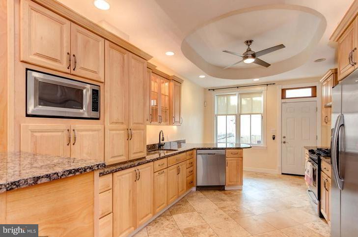 THIS IS THE ONE YOU'VE BEEN WAITING FOR!! Luxurious 4-BR, 3-BA Canton Townhouse is special in so many ways. Premium finishes throughout: maple hardwood floors; gourmet kitchen with stainless steel appliances, granite counters with a breakfast bar; fully-fenced, private patio; plenty of closet space; 3rd floor entertaining room with WET BAR & GAS FIREPLACE....leading to a ROOFTOP DECK with breathtaking city views! Sorry, No smoking permitted in the home. Pets on a case-by-case basis. WELCOME HOME!!