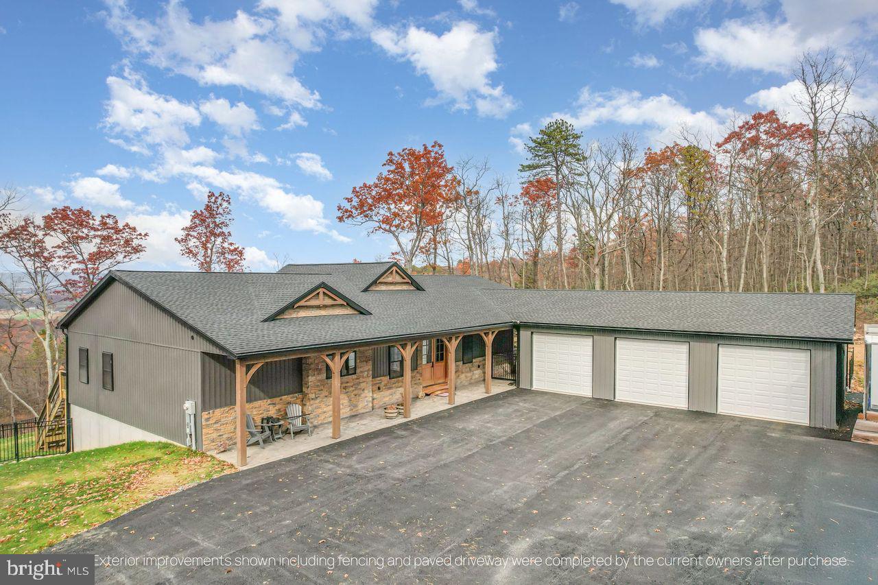 BEAUTIFUL NEW CUSTOM HOME BY CASSELL HOMES SITUATED ON 11.21 WOODED ACRES IN IDEAL PRIVATE SETTING WITH MILLION DOLLAR VIEW OF THE VALLEY & GORGEOUS SUNSETS.  OVER 5600 SQ FT OF FINISHED LIVING SPACE WITH THIS AMAZING RANCH HOUSE WITH FINISHED WALKOUT BASEMENT & 3 CAR GARAGE.