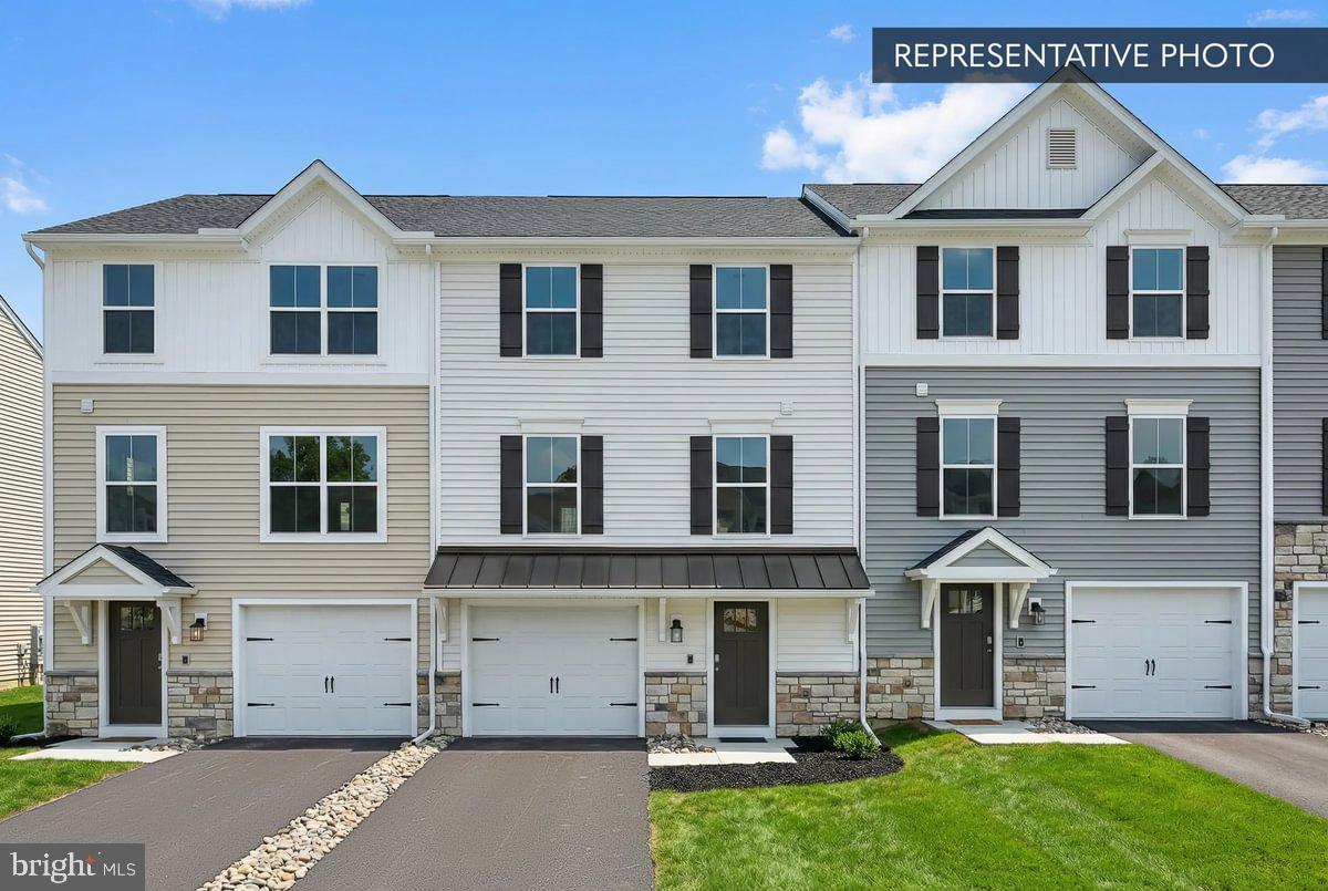 Homesite 16 at Villas at Pine View is an end-unit Iris townhome by Berks Homes currently under construction, with an estimated completion of August 2026 (estimated — subject to change). End units bring extra windows and added natural light, and this one is finished to a level that makes every detail count — all selections have been made, so it's ready to go the moment it's complete.
The main living level is built for real life. The family room is bright and open, with four recessed lights on a dimmer, and flows naturally into a kitchen that earns its keep — upgraded cabinetry with custom hardware, quartz countertops, a tile backsplash, upgraded faucet, stainless steel electric appliances, and an island with pendant lighting. A double box window in the breakfast area brings in even more light, and the powder room is finished with upgraded plumbing fixtures. Step outside to a 10' × 10' pressure-treated deck with vinyl railing — an easy place to start or end the day.
Upstairs, the primary suite features a raised double-bowl vanity with cultured marble top, upgraded cabinetry, a walk-in closet, and an upgraded shower. Two additional bedrooms and a hall bath with upgraded vanity, cultured marble top, and fixtures complete the top floor. Upgraded EVP, carpet, and vinyl flooring run throughout their respective zones, and 2-tone flat paint gives everything a clean, finished look.
The lower level entry is finished and carpeted, with a one-car garage equipped with a LiftMaster opener with integrated camera, myQ connectivity, two remotes, and a wireless keypad. A media chase is prewired and ready for your TV wall setup.
All selections are finalized — this Quick Move-In home is ready when you are. 

Berks Homes' 10-year warranty included. Subdivision assessment pending; taxes based on completed home. Photos may include options or upgrades not reflected in list price and may be virtually staged or digitally enhanced.