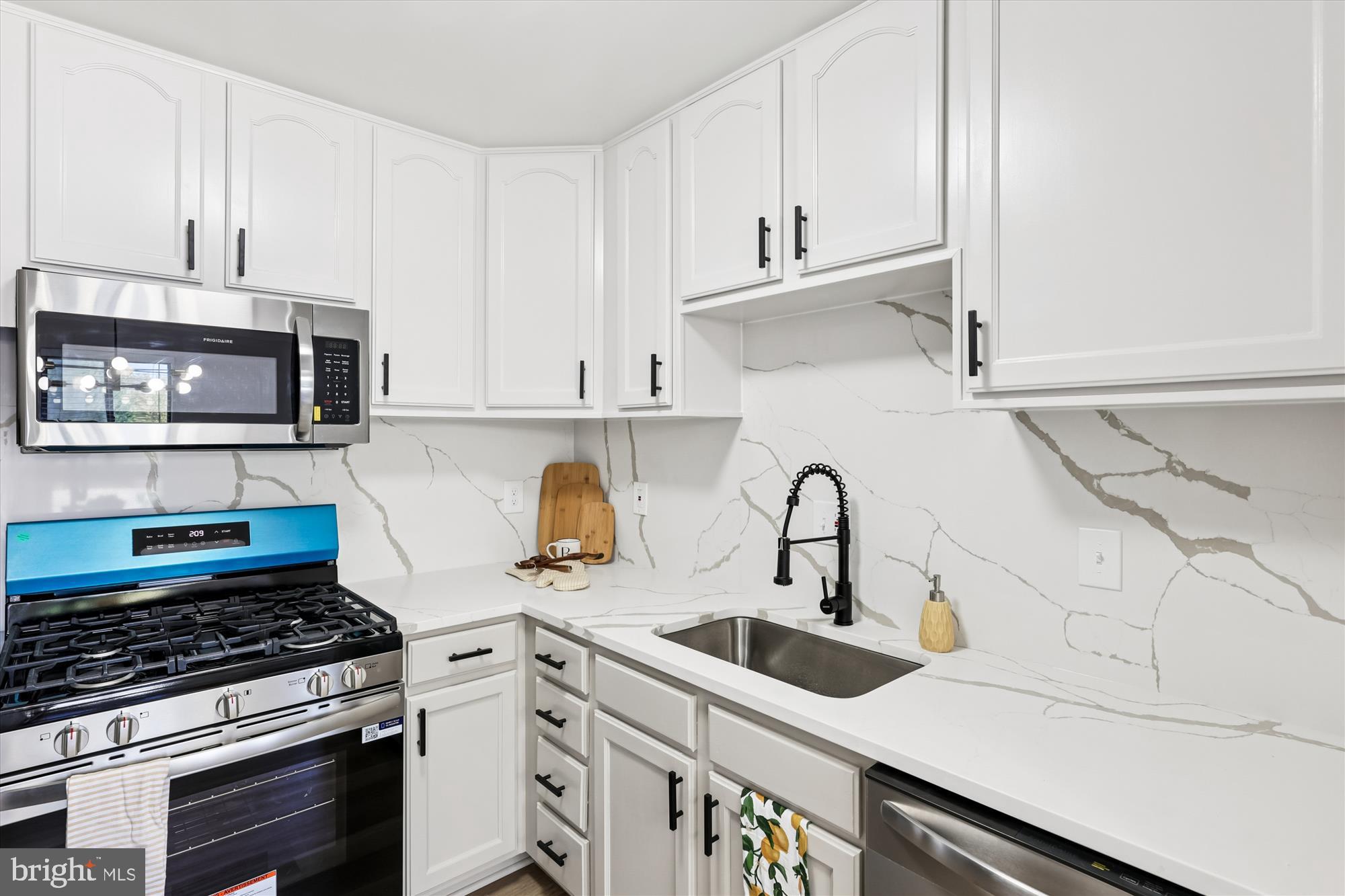 Price Improvement! This home qualifies for a $10k grant and a $5k closing credit! Forget the stress of endless searching! This is the turnkey opportunity you've been waiting for. This inviting 2-bedroom, 1-bath unit at Hillwood Condominium has been completely refreshed, providing 785 square feet of open and modern living, just moments from everything DC has to offer. The entire space has been drenched in fresh paint, providing a bright canvas for the new LVP flooring that flows seamlessly through the main areas. The kitchen is the true centerpiece, featuring sleek quartz countertops, a matching quartz backsplash, and a complete suite of new stainless steel appliances. Both bedrooms offer comfortable retreats with plush new carpeting and ample closet space. Additional updates include new light fixtures throughout, an updated bathroom, and the must-have convenience of a brand-new in-unit washer and dryer. As a BONUS, there is a dedicated assigned parking space, which eliminates city parking hassles. Enjoy a seamless commute via the nearby Anacostia Metro, catch a game at the Nationals Park Stadium, go for a run at Anacostia Park, or spend weekends exploring historic Eastern Market. With endless shopping and restaurants (Busboys & Poets, Turning Natural, and Kitchen Savages) at your doorstep, this move-in-ready gem is the lifestyle upgrade you’ve been waiting for! Move-in ready and perfectly priced-schedule your private showing today and make this Hillwood gem your new home! (Condo is not FHA approved)