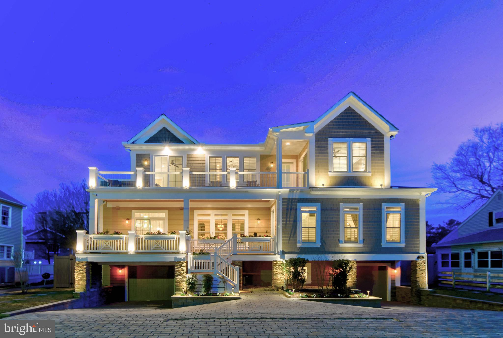 SHOW STOPPING LUXURY BEACH RETREAT!  This resort style residence offers stunning interior and exterior spaces that have been customized with impeccable taste and highest quality materials that evoke a feeling of elegance with an emphasis on entertaining. Custom built on a large (1 1/2 lot) -high elevation lot in 2016, renovated and decorated 2016/2017 to create this master piece in Rehoboth By The Sea. No detail overlooked with over 5000+ sq ft of heated living space, over 3000+ sq ft of decks, porches, patio's, in-ground salt water pool, separate hot tub area, outside shower, privacy fencing, 3 garage spaces as well as amble off street parking. Decorator furnished with 6 bedrooms, 4 with en suite bathrooms (6 1/2 baths total), each designed with their own unique style yet blending beautifully through-out residence. Three separate living spaces with main space open to kitchen, dining, decks, porch etc. for an open concept feel. Two additional living areas offer custom wet bars with access to exterior spaces. Gourmet Chef's kitchen offers large quartz island, Sub Zero refrigeration, Wolfe cooktop & double wall ovens, 2 dishwashers, two sinks, separate bar area with sub zero wine/refrigeraton, ice maker, custom marble back splash, specialty lighting & random width wood ceiling. Two laundry areas, dining areas as well as the most elaborate smart home security, lighting, music (inside and out) and WiFi whole house systems. Home theater surround sound with high quality large screen TV's (9 total). True Luxury living in the best kept locals secret beach - Rehoboth By The Sea.  Steps to the beach/ocean,  walk into Rehoboth or Dewey Beach... or jump on the jolly trolly - corner of Cullen. No need to drive once you reach your Rehoboth By The Sea Retreat! AND, ALL OUTSIDE TEAK FURNITURE INCLUDING CUSTOME SUMBRELLA CUSHIONS INCLUDED IN THE SALE.