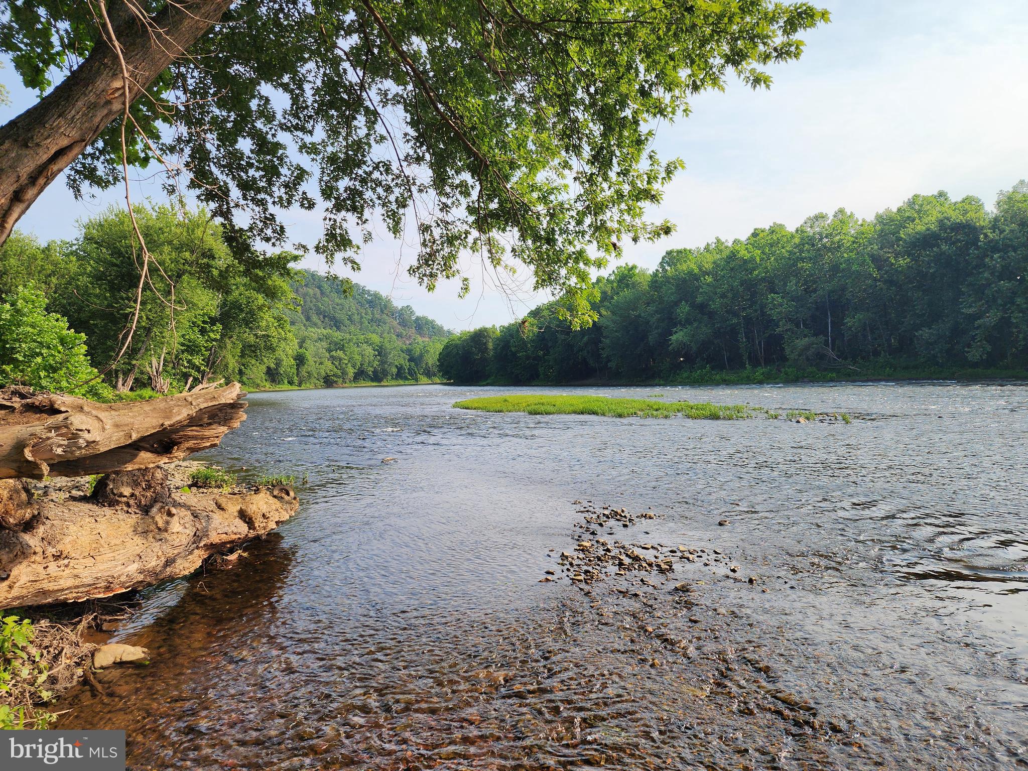 A Once-in-a-Lifetime legacy property known historically as "Tippecanoe." Opportunities of this magnitude are extraordinarily rare. This unrestricted tract offers an unmatched combination of natural beauty, history, recreation, and development potential that may never be duplicated. One of the property's most remarkable features is that a portion of the land lies between the Potomac River and the C&O Canal National Historical Park—one of the last known tracts where private ownership exists in this unique setting. With nearly a mile of frontage along the Potomac River, beautiful bottom fields, county road access, frontage on state forest land, and adjoining National Park property, this is truly a one-of-a-kind offering. Located just 1.5 miles from Paw Paw, WV by road and a little over one mile along the C&O Canal Towpath from the historic Paw Paw Tunnel, the possibilities are endless. Purslane Run flows through the property, passing beneath the canal through a historic viaduct, while an 1800s cemetery serves as a reminder of the property's rich heritage. Additional improvements include an older mobile home with well and septic already in place, a pond, and an extensive network of roads and trails created through recent timbering, providing exceptional access throughout the property while enhancing wildlife habitat. The upper elevations reward you with long-range mountain views, while the river bottom offers fertile fields and exceptional water access. Whether your vision includes a private family estate, hunting and fishing preserve, campground, Airbnb village catering to canal travelers, residential development, equestrian property, or an investment in one of the Mid-Atlantic's most unique recreational tracts, this property offers virtually unlimited possibilities. Conveniently located just two hours from the Washington, D.C. and Baltimore metropolitan areas, this is more than just a piece of real estate—it's a legacy property unlike any other. Super rare. Super unique. Simply one of the most extraordinary land offerings to come to market in the region. ( property boundaries noted in pictures are approximate and not based on a survey )