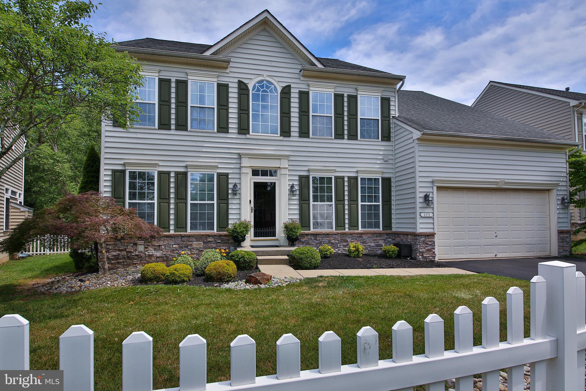 Offered for the first time, this one owner, 4 bedroom, 2.5 bath is the largest model home in the highly sought after neighborhood of Bedminster Hunt. The appeal of this community becomes apparent as you drive down Barnhill Rd, lined with mature trees and cobblestone curbing. As you approach this stately two-story colonial, the white PVC picket fence, surrounded by elegant plantings, framed perfectly in river jack and mulch invites you into driveway. The stone waterboard, wall sconces, window crossheads, and the transom window above the front door offer timeless appeal. As you enter the 2 story foyer, there are so many details to take in, including the Brazilian hardwood floors, waterfall staircase with black risers & railings with white accent spindles and stained wood treads. To your left, this versatile space is currently being utilized as a dining area and features elegant white columns, floor to ceiling windows, oversized crown molding, ceiling speakers and a barn wood accent wall. To your right is everything you’ve ever wanted in a home office including floor to ceiling windows, oversized crown moldings and double french door entryway with transom light. Head down the hallway past the recently renovated powder room into the heart of the home: the gourmet kitchen featuring maple cabinets, granite counter tops, tile backsplash, center island with bar seating, Edison bulb light fixture, dimmable recessed lighting, pantry closet, stainless stain double wall ovens, gas cooktop, built in microwave, dishwasher & under mount sink. With plenty of room for informal dining just off the kitchen and a slider with transom  offering entry to the rear yard, the open concept floor plan flows nicely right into the family room. This bright and airy space is perfect for relaxation and offers oversized windows, stone fireplace, dimmable recessed lighting and a comfy, homey feel. The crown jewel of the main level is currently the pool table room featuring tray ceilings, Multiple layers of crown moldings, chair rail and shadow boxes throughout. Head up the waterfall staircase to the upper level and enter the huge master bedroom suite through double entry doors and it becomes obvious that you can see yourself living here. With tray ceilings, his and hers walk in closets, plenty of space for all the furniture you could possibly want and a master bathroom that compliments the bedroom perfectly, including twin cherry wood vanities, soaking tub, oversized glass door stall shower, toilet closet and tile throughout. The upper level also offers 3 additional oversized bedrooms with large closets and a hall bath with tub/shower and plenty of storage space. Last but not least, head downstairs to the fully finished lower level with wet bar, built in cabinetry, ceiling speakers, recessed lights and plenty of space for a game room, theater room, gym, hobby area or finish the storage area into an additional bedroom. With rough ins for a full bathroom next to the utility closet, the lower level offers so much in its current state and even more future possibilities like an in-law suite. The oversized garage features plenty of room for your vehicles, outdoor toys, tools and work benches. With preserved farm land, walking trails, playgrounds and an HOA that maintains your lawn, this community has so much to offer. Walking distance to downtown Dublin including fine dining, craft tap room, and artisan shops. Minutes to Doylestown, Quakertown, 313, 611 & 413. Welcome Home!