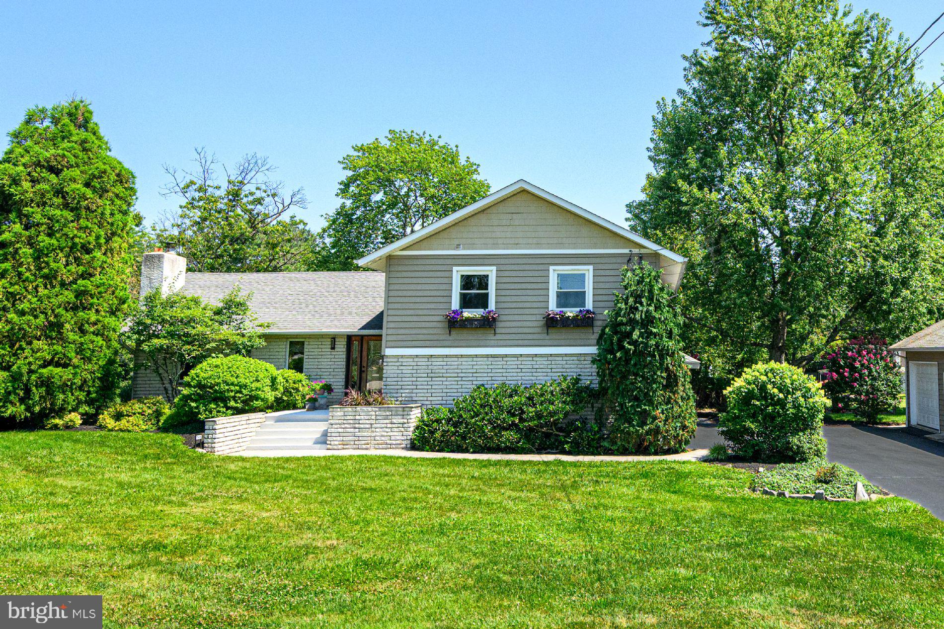 Located in Methacton School District, a short stroll to the elementary school and park,  this multi level home has desirable features. A spacious great room with hardwood flooring and kitchen with vaulted ceilings, skylights and direct access to large deck and backyard. Floor to ceiling stone fireplace, dining room with hardwood floors.  Open concept first  level with a tiled den , wood burning stove, slider to large patio and backyard. Separate laundry room and bath with a tiled shower. Upper level has 4 bedrooms and 2 full baths.  Primary suite has updated bath, tiled shower with dual heads, oversized closet, and a balcony overlooking mature landscaped yard. BONUS is the 25x15 in home office with its own entrance and the ability to double as a rec room,or in law suite. Large basement houses the mechanicals, with potential for your own renovation. EXTRA BONUS is detached 40x30 HEATED garage with a loft.  Plenty of space for car enthusiast, hobbyist or a contractor to work. Multiple car onsite parking.
Situated in Lower Providence Township, this property offers accessibilty to all major roads for work,shopping and play.  Minutes from Valley Forge Park, Skippack Village,King of Prussia and Schuykill River bike trail. Nestled in amongst established neighborhoods this uniquely designed home is a standout on what it offers! A MUST SEE TO APPRECIATE !