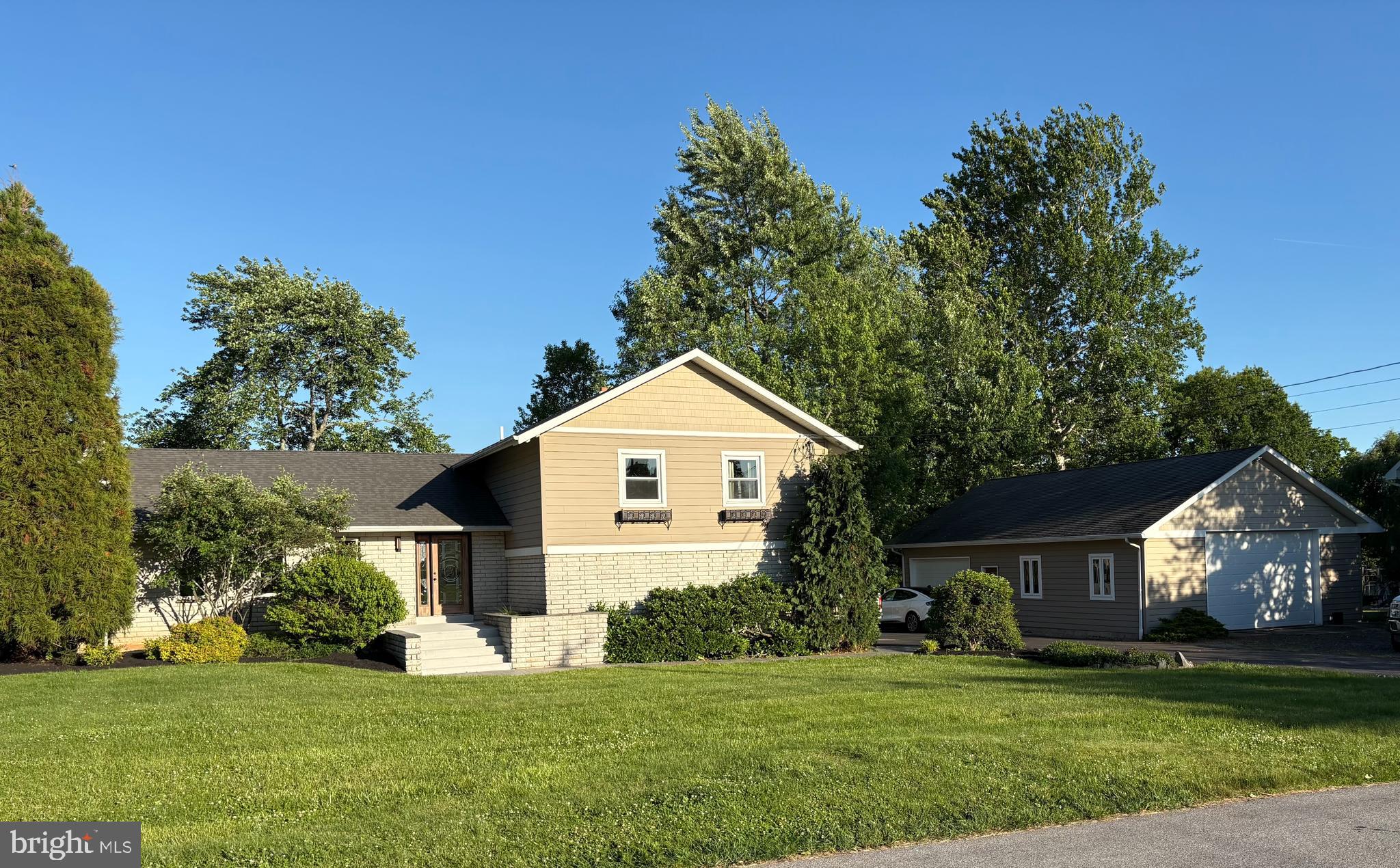 Located in Methacton School District, a short stroll to the elementary school and park,  this multi level home has desirable features. A spacious great room with hardwood flooring and kitchen with vaulted ceilings, skylights and direct access to large deck and backyard. Floor to ceiling stone fireplace, dining room with hardwood floors.  Open concept first  level with a tiled den , wood burning stove, slider to large patio and backyard. Separate laundry room and bath with a tiled shower. Upper level has 4 bedrooms and 2 full baths.  Primary suite has updated bath, tiled shower with dual heads, oversized closet, and a balcony overlooking mature landscaped yard. BONUS is the 25x15 in home office with its own entrance and the ability to double as a rec room,or in law suite. Large basement houses the mechanicals, with potential for your own renovation. EXTRA BONUS is detached 40x30 HEATED garage with a loft.  Plenty of space for car enthusiast, hobbyist or a contractor to work. Multiple car onsite parking.
Situated in Lower Providence Township, this property offers accessibilty to all major roads for work,shopping and play.  Minutes from Valley Forge Park, Skippack Village,King of Prussia and Schuykill River bike trail. Nestled in amongst established neighborhoods this uniquely designed home is a standout on what it offers! A MUST SEE TO APPRECIATE !
