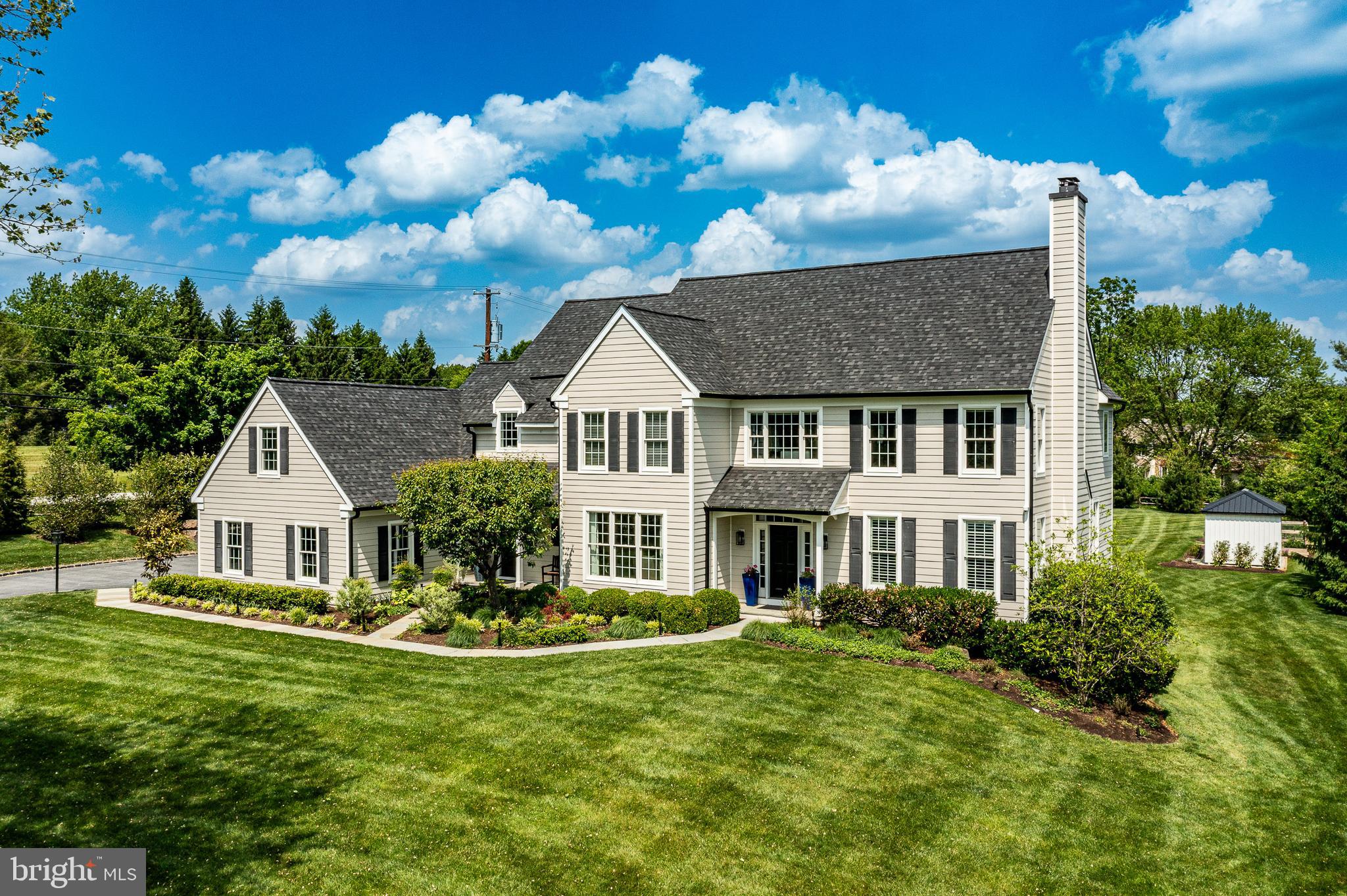 Nestled in the coveted Rossmore community of Malvern, 101 Tramore Circle is a masterclass in luxury, thoughtful design, and everyday functionality. Completely renovated from top to bottom—with the exception of two bathrooms—this exceptional residence offers 5 bedrooms, 4 full bathrooms, and 2 powder rooms, all curated with timeless style and uncompromising quality.

From the moment you arrive, the home’s new roof, new windows, and impeccable landscaping set the tone for what awaits inside. Every detail has been carefully considered to create a home that is both sophisticated and effortlessly livable.

At the heart of the home is a stunning custom kitchen by Dilworth Kitchens, featuring commercial-grade appliances, bespoke cabinetry, and beautifully selected finishes. The adjoining breakfast room opens seamlessly to a custom outdoor patio complete with a built-in kitchen, fire pit, and elegant slate pavers—perfect for entertaining or quiet evenings at home.

Designed with versatility in mind, the formal living room has been transformed into a stylish billiards room, while the main-floor office now serves as a custom playroom. Additional living and recreation space can be found in the expansive lower level.

Upstairs, the luxurious primary suite has been entirely reimagined. The entrance was repositioned, the walk-in closet expanded, and the spa-inspired bathroom fully redesigned to rival the pages of Architectural Digest. Heated porcelain  floors, custom cabinetry, designer countertops, an oversized shower, and exquisite tile and fixture selections create a truly elevated retreat.

The remaining four bedrooms have all been refreshed with new windows, fresh paint, and updated carpeting or flooring. A thoughtfully designed upper-level laundry room includes custom cabinetry, storage bins, a sink, and a folding station for added convenience.

The lower level offers an entirely unique experience, featuring a professionally designed gym with specialty flooring, along with an imaginative children’s play area complete with climbing features, a slide, and cozy reading spaces.

Outside, the large, flat backyard is a private oasis framed by mature trees, extensive landscaping, dramatic boulders, and fencing. An outdoor shower, discreetly tucked away for privacy, adds a resort-style touch.

101 Tramore Circle is more than a home—it is a showcase of quality craftsmanship, refined style, and intentional design in one of Malvern’s most desirable neighborhoods.