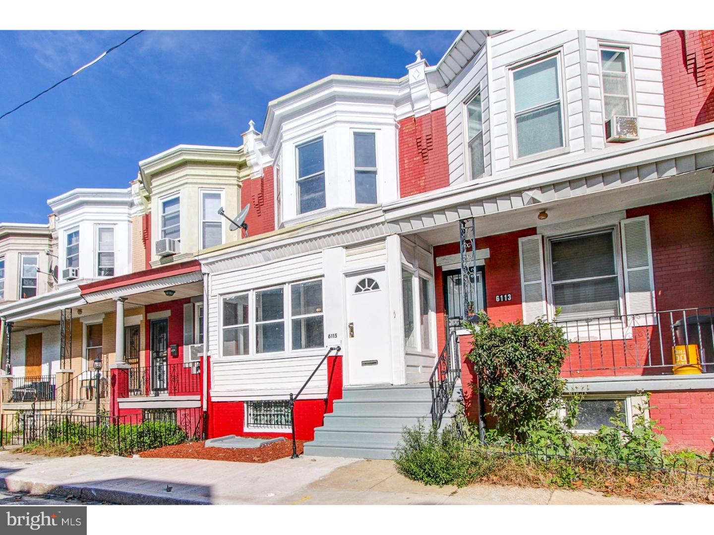 Step right up to this bright and cheery row home for sale in the Cobbs Creek section of the city. A beautifully updated front exterior welcomes you as you approach and enter the sunroom. Egress through and take notice of the expansive bay windows that will flood your days with natural lighting. A rustic brick mantle and newly laid hardwood flooring add to the earthy and warm feeling that is spread throughout the first landing. Enter straight through a quaint dining space which than leads into the kitchen. Updates include granite countertops, stainless steel appliances, and a new set of cabinets to top it all off. Along the stairs and throughout the second landing new carpeting has been laid.  Upstairs one will discover two personal sized bedrooms and an elegant front facing master bedroom with ample room for stretching out. The full hall bathroom compliments that modern charm that exists throughout this landing. In the lower level of the home is a full basement for additional storage and living space. Conveniently located near the Cobbs Creek Park & all the sights and sounds of West Philadelphia, allow your journey to guide you toward this special home!