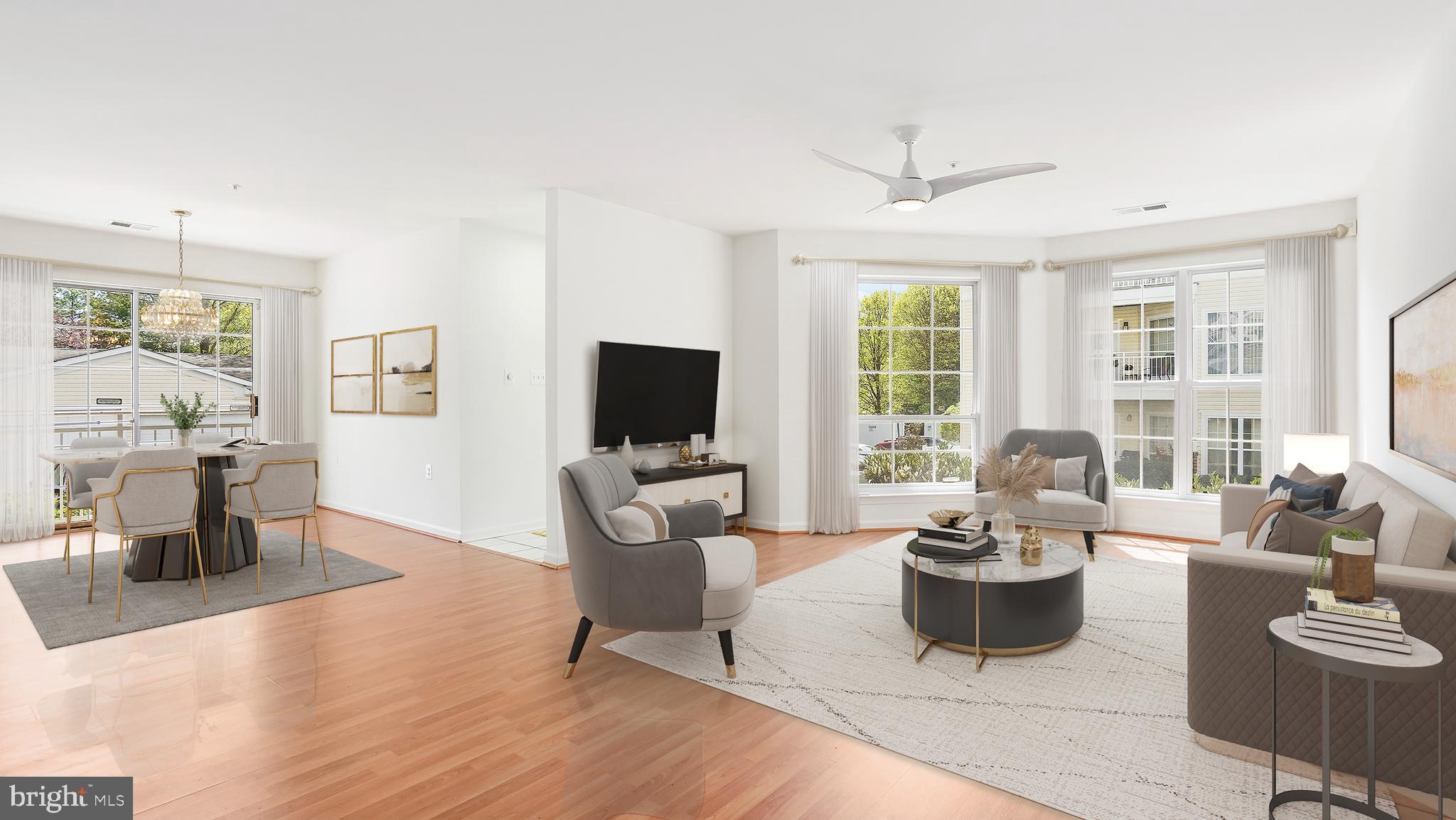 Welcome home to this beautifully updated first-floor condo in a secured building, offering the perfect blend of comfort, convenience, and low-maintenance living. Step inside to find stylish Luxury Vinyl Plank flooring flowing through the bright and spacious living and dining areas—ideal for entertaining guests or simply relaxing. Off the dining room, sliding doors open to a Juliet balcony, bringing in natural light and a touch of charm. The kitchen features ample cabinet and prep space, along with a stunning floor-to-ceiling window that fills the room with sunshine. The spacious primary suite boasts brand new carpeting, a large walk-in closet, an additional closet, and a private full bath with a generous vanity and a walk-in tile shower. The second bedroom includes new LVP flooring and another walk-in closet, while the second full bath features a relaxing tub/shower combo. A dedicated laundry room with extra shelving and a coat closet offer bonus storage. Start your mornings with a cup of coffee on your covered patio and enjoy the peaceful sunrise. This quiet community also offers scenic walking paths and a gazebo—perfect for reading or unwinding outdoors. Plenty of shared parking is available for you and your guests. Updates include: water heater (2024), carpet (2025), whole unit painted (2025). Conveniently located near The Quarry in Pikesville, Greenspring Avenue, Falls Road, I-695, I-83, and an abundance of shops and restaurants. Don’t miss this move-in ready gem!