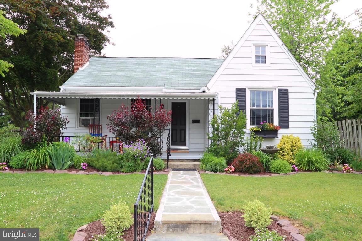 Beautifully updated home with remodeled kitchen and bathroom, hardwood floors, replacement windows, fireplace and pristine landscaping.  Convenient attached 1-car garage, private yard and a great spot to relax on the covered front porch.  Second floor offers room to expand or potential 3rd bedroom. Includes 1-year home warranty for buyer and all appliances.